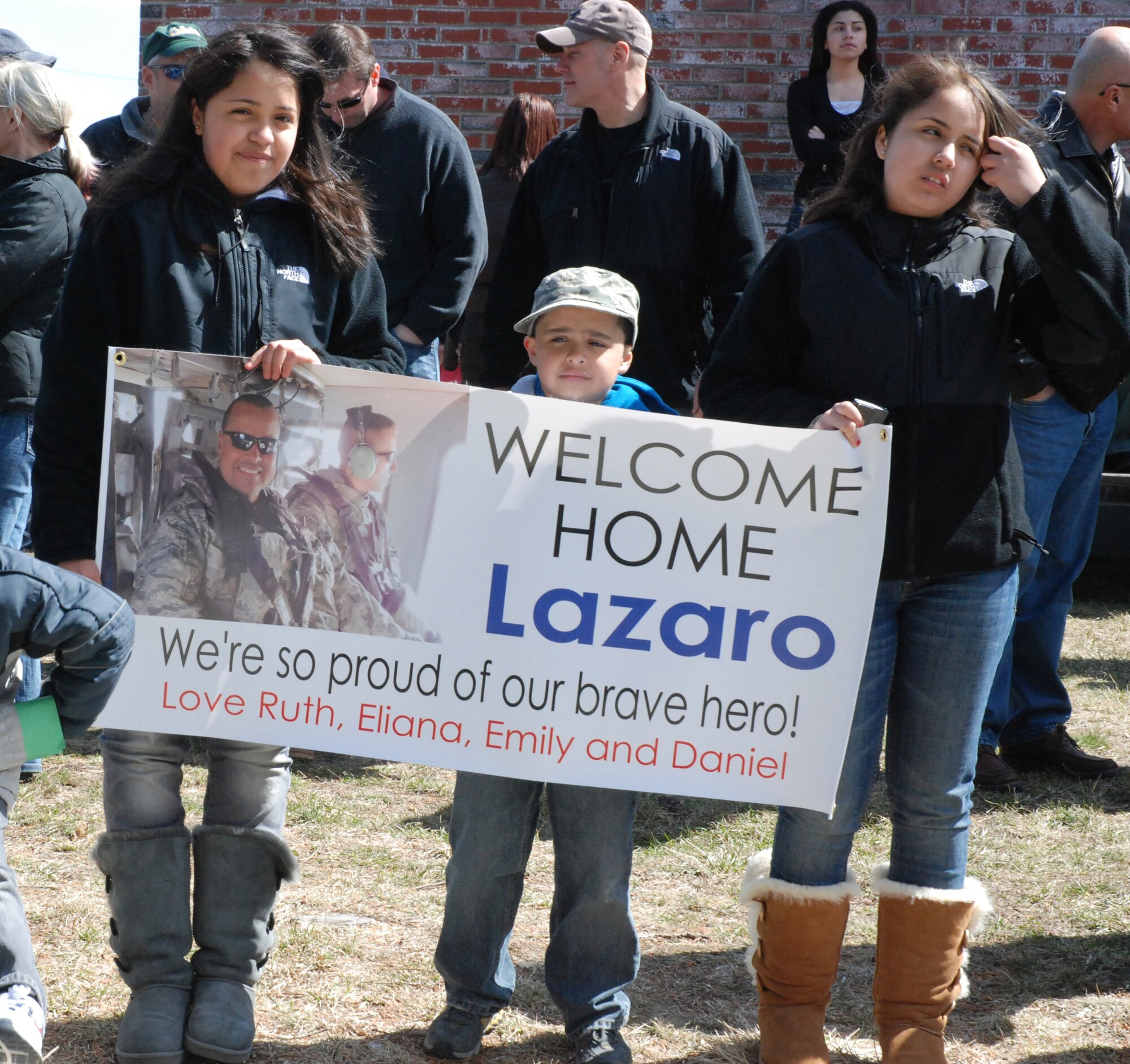 Security Forces from the 439th Airlift Wing were greeted by almost 100 family and fellow reservists as they came home from a 180-day-tour in Afghanistan. Their bus was escorted to the teary-eyed and enthusiastic crowd near the Security Forces building at Westover by the Chicopee Police Department. (US Air Force photo/Master Sgt. Andrew Biscoe)