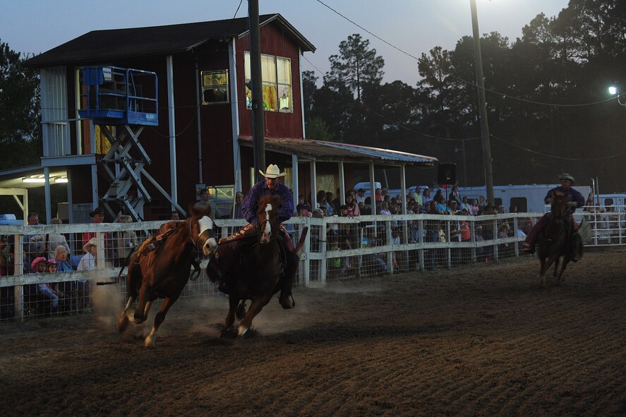 MOODY AIR FORCE BASE, Ga.--  A cowboy wrangles a horse after a bareback riding event March 25. The cowboy was thrown of his horse before the eight-second bell, earning minimum points for this event.  (U.S. Air Force photo/Senior Airman Stephanie Mancha)(RELEASED)