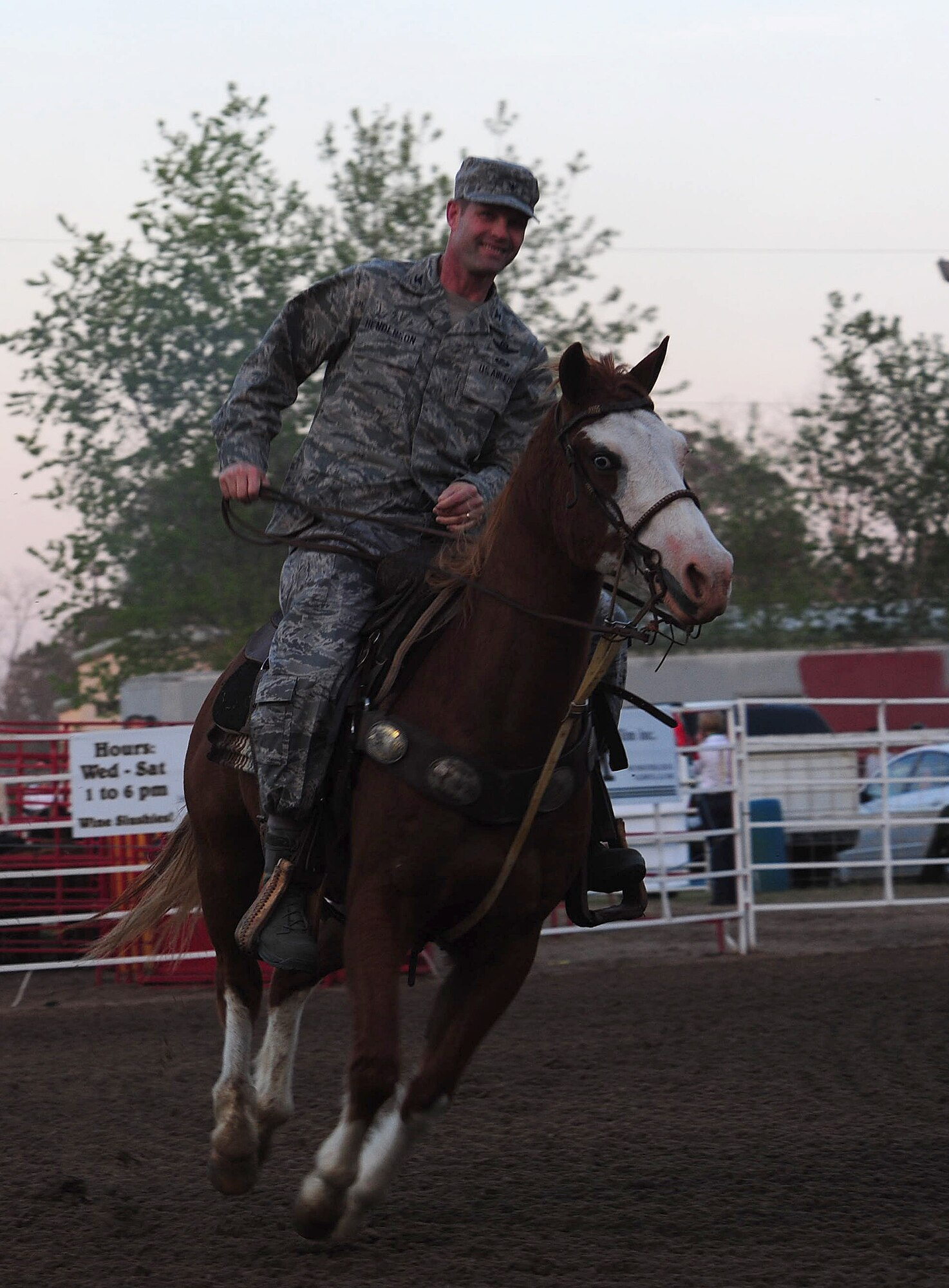 MOODY AIR FORCE BASE, Ga.-- Col.  Gary Henderson, 23rd Wing commander, rides into the arena of the Cotton Blossom Round-up Rodeo March 25. Colonel Henderson and Chief Master Sgt. Frank Batten, 23rd WG command chief, were invited to start the rodeo off by riding  horses for the military appreciation day.(U.S. Air Force photo/Senior Airman Stephanie Mancha)(RELEASED)