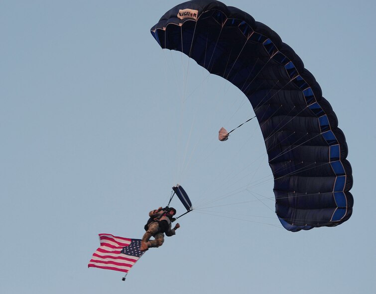 MOODY AIR FORCE BASE, Ga.-- Master Sgt. Albert Braddock, 38th Rescue Squadron pararescueman, jumps from an HH-60G Pave Hawk  into the Cotton Blossom Round-up Rodeo arena for military appreciation day March 25. Many events with military members took place to include the posting of the colors, singing of the national anthem, honorary horseback rides for the 23rd Wing commander and command chief, and a parachute jump. (U.S. Air Force photo/Senior Airman Stephanie Mancha)(RELEASED)