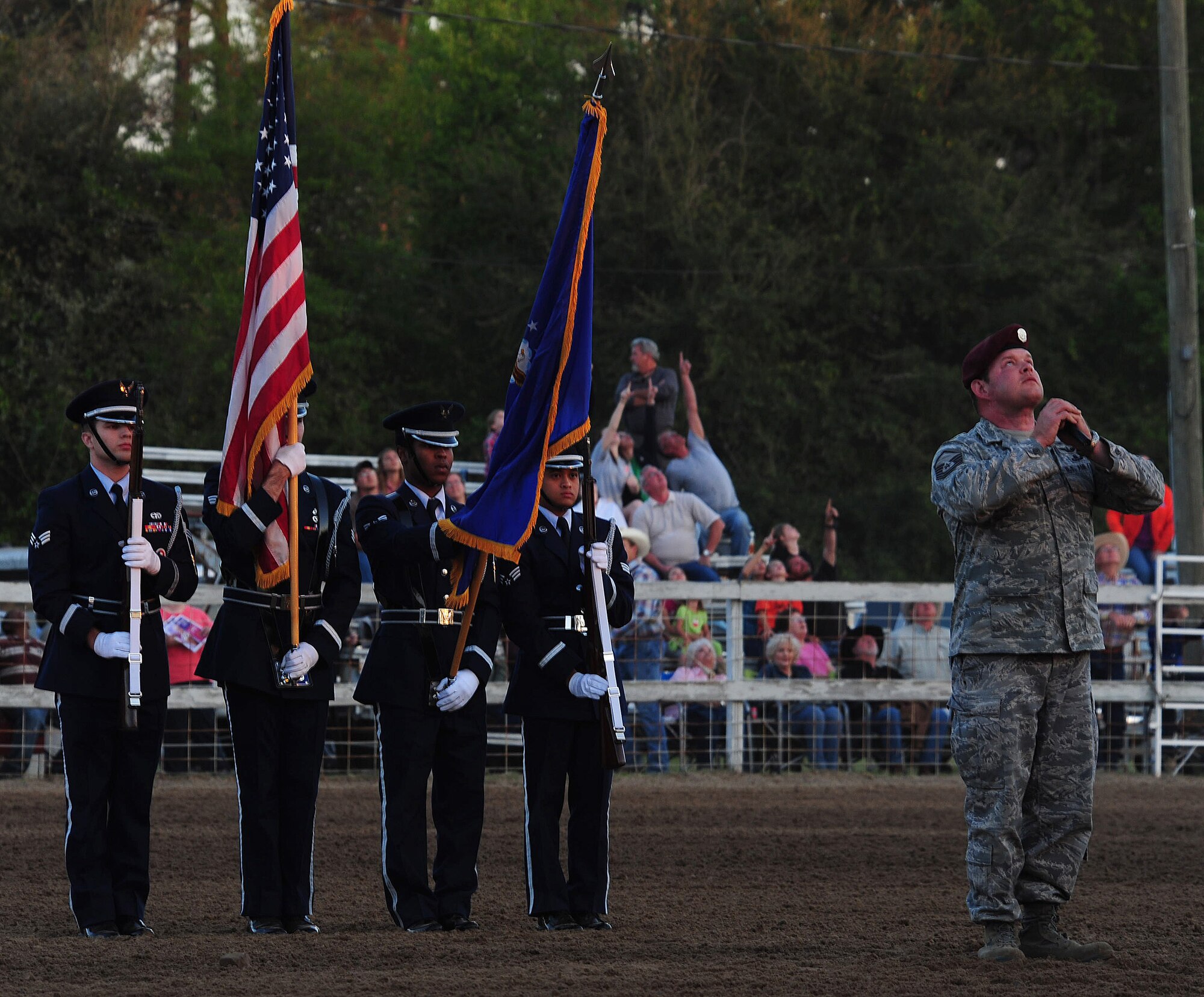 MOODY AIR FORCE BASE, Ga.--Master Sgt. Robert Disney, 347th Rescue Group superintendent, calls for Master Sgt. Albert Braddock, 38th Rescue Squadron pararescueman, to jump from an HH-60G Pave Hawk March 25. Sergeant Disney also sang the national anthem for the posting of the colors and to kick-off the rodeo events. (U.S. Air Force photo/Senior Airman Stephanie Mancha)(RELEASED)