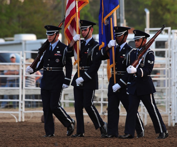 MOODY AIR FORCE BASE, Ga.-- Members of the Moody Air Force Base Honor Guard walk into the arena of the Cotton Blossom Round-up Rodeo March 25. The Moody Air Force Base Honor Guard opened up the event by posting the colors. (U.S. Air Force photo/Senior Airman Stephanie Mancha)(RELEASED)