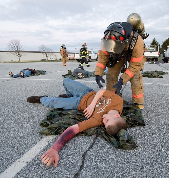 24 Mar 2011  USAF Photo by Jason MintoBase exercise behind bldg 639.  A1C Christopher McKinstry 736th AMXS on the ground acting injured during the base MARE (U.S. Air Force photo by Jason Minto/Unreleased)