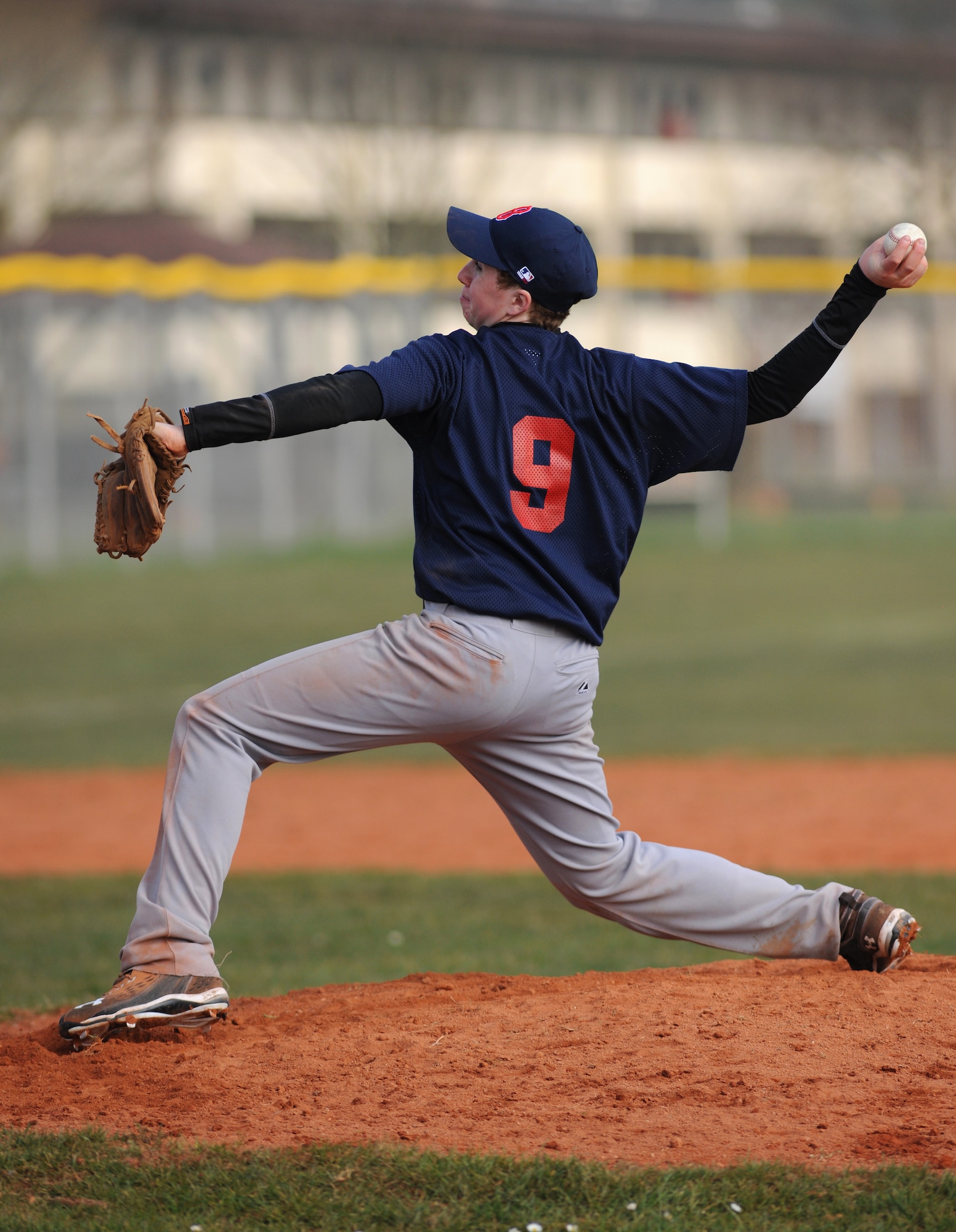 SPANGDAHLEM AIR BASE, Germany – Bitburg High School senior Notley Reavis pitches the ball during the opening game of the season against Supreme Headquarters Allied Powers Europe American High School here March 26. The SHAPE Spartans defeated the Bitburg Barons 5-4 the first game of a doubleheader. The Barons defeated the Spartans 12-3 the second game. (U.S. Air Force photo/Senior Airman Nathanael Callon)