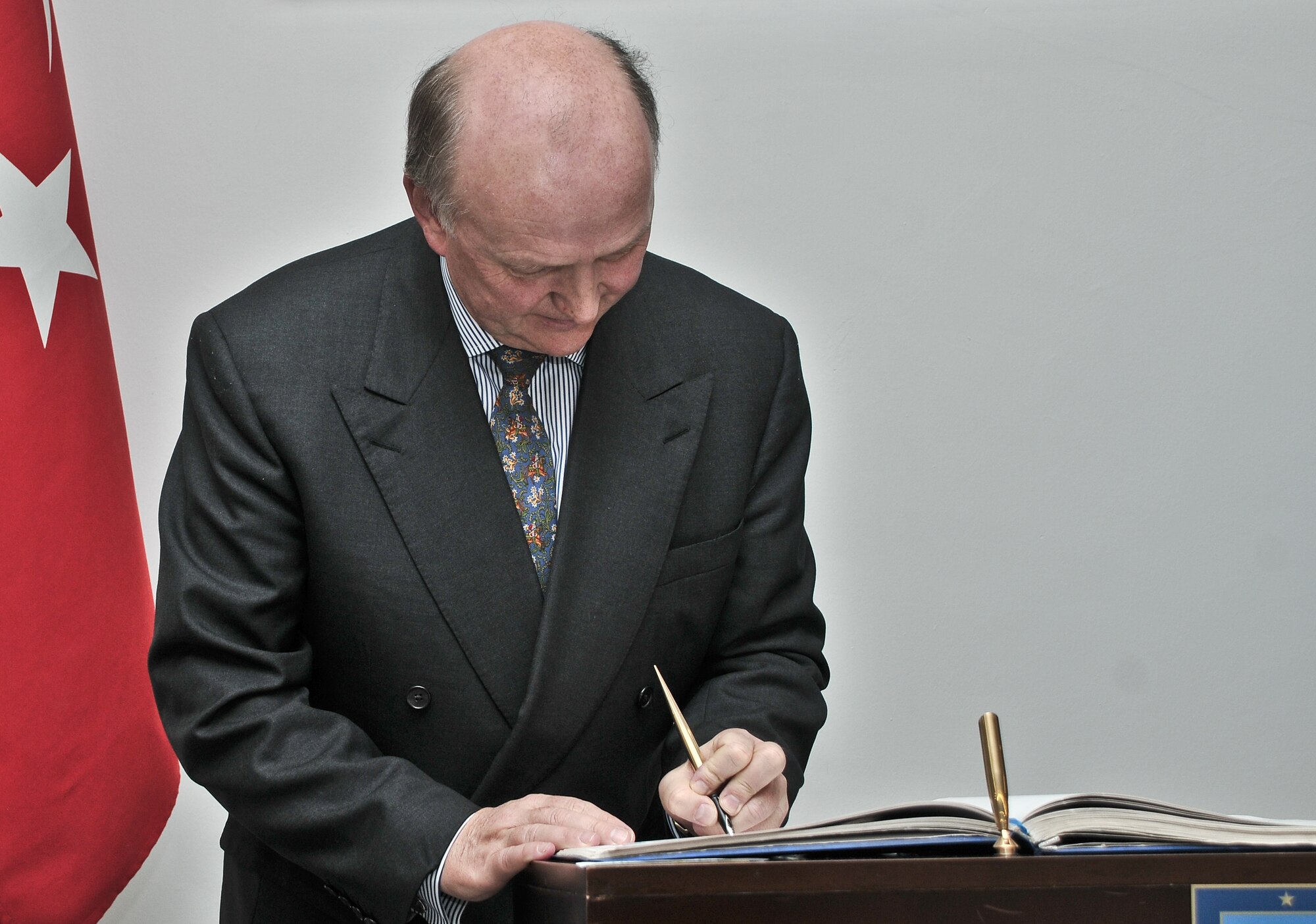 David Reddaway, the British ambassador to Turkey, signs the honor book for the Turkish 10th Tanker Command at Incirlik Air Base, Turkey March 16, 2011. Signing the book is a Turkish military tradition for distinguished visitors. During his visit, the ambassador had an office call with the commander of the 10th Tanker Command and received a base tour to learn more about the missions of the 10th Tanker Command and the 39th Air Base Wing, and how the units work together, officials said. (U.S. Air Force photo by Staff Sgt. Alexandre Montes/Released)