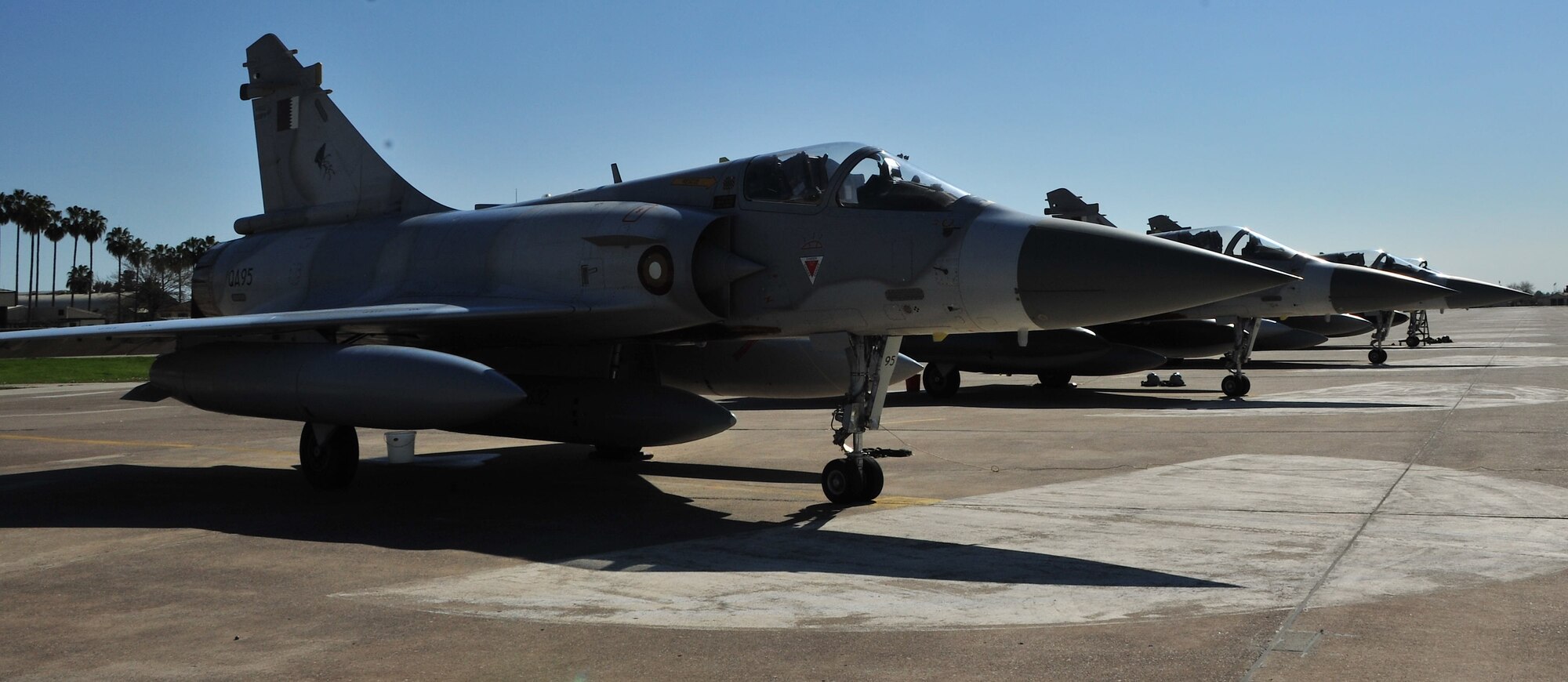 Qatari air force pilots complete post-flight checks during their stop at Incirlik Air Base, Turkey, to refuel in support of Operation Odyssey Dawn March 25, 2011. Joint Task Force Odyssey Dawn is the U.S. Africa Command task force established to provide operational and tactical command and control of U.S. military forces supporting the international response to the unrest in Libya and enforcement of United Nations Security Council Resolution 1973. UNSCR 1973 authorized all necessary measures to protect civilians in Libya under threat of attack by Qadhafi regime forces. JTF Odyssey Dawn is commanded by U.S. Navy Admiral Samuel J. Locklear, III. (U.S. Air Force photo by Staff Sgt. Alexandre Montes)