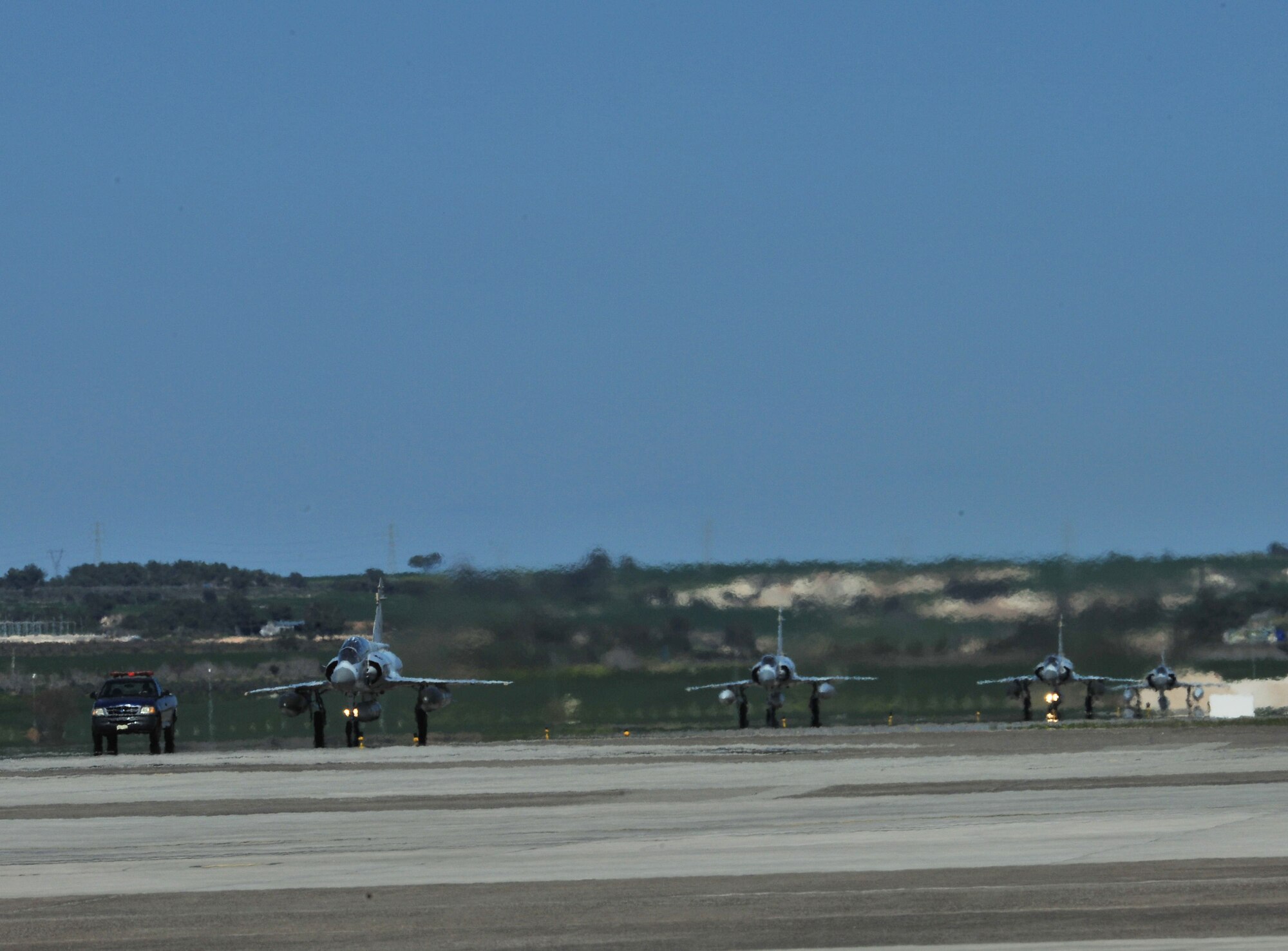 Qatari Mirage F-1 jets taxi down the runway to refuel in support of Operation Odyssey Dawn March 25, 2011, at Incirlik Air Base, Turkey.  Joint Task Force Odyssey Dawn is the U.S. Africa Command task force established to provide operational and tactical command and control of U.S. military forces supporting the international response to the unrest in Libya and enforcement of United Nations Security Council Resolution 1973. UNSCR 1973 authorized all necessary measures to protect civilians in Libya under threat of attack by Qadhafi regime forces. JTF Odyssey Dawn is commanded by U.S. Navy Admiral Samuel J. Locklear, III. (U.S. Air Force photo by Staff Sgt. Alexandre Montes)