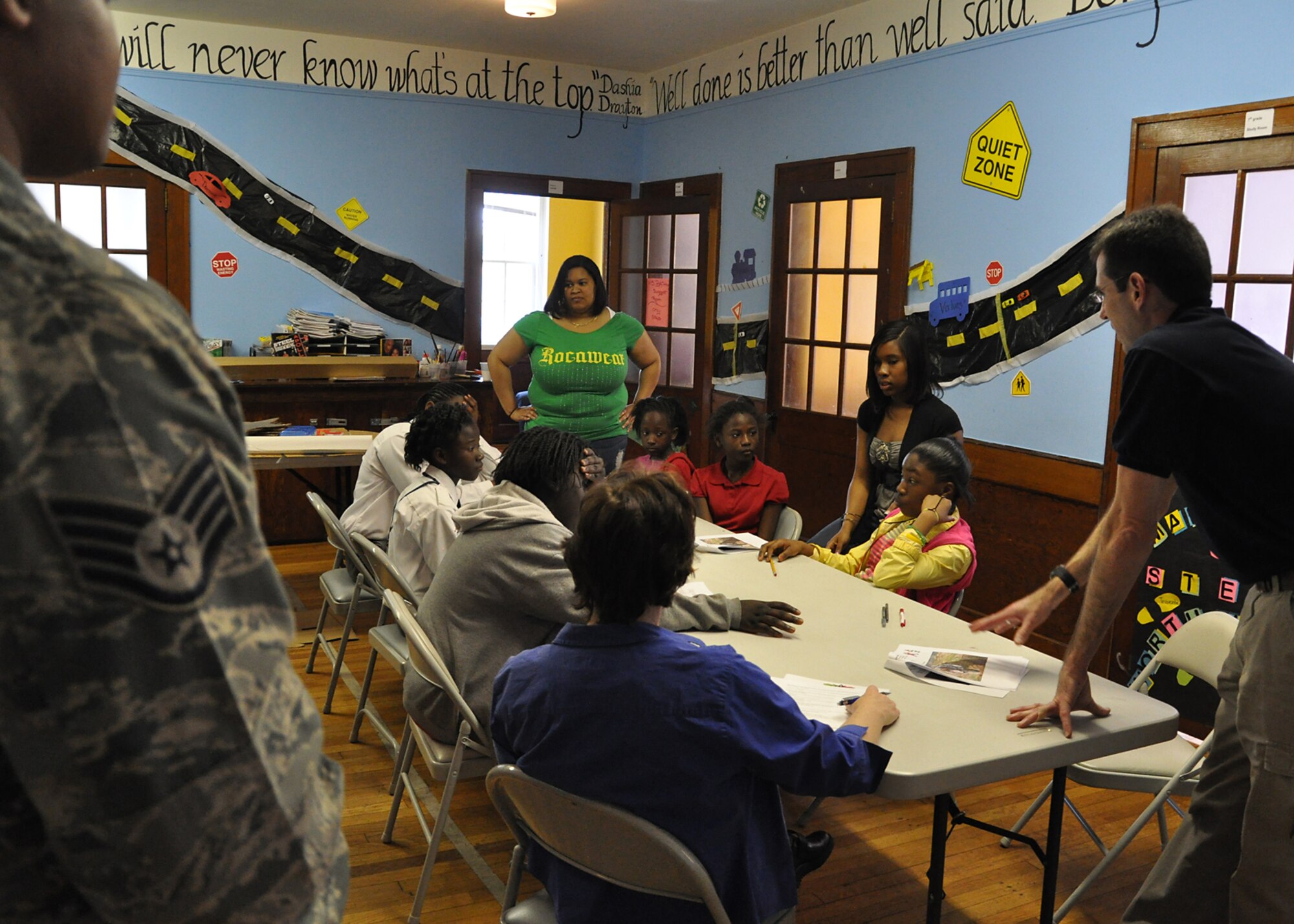 Members from the 315th Airlift Wing Public Affairs office here took time to step from behind the camera and take to the classroom sharing their knowledge and passion for photography with children who participate in an educational partnership between Metanoia and Safe Kids USA at Saint Mathews Church in North Charleston, S.C. March 14. (U.S. Air Force photo by Senior Airman Bobby Pilch)