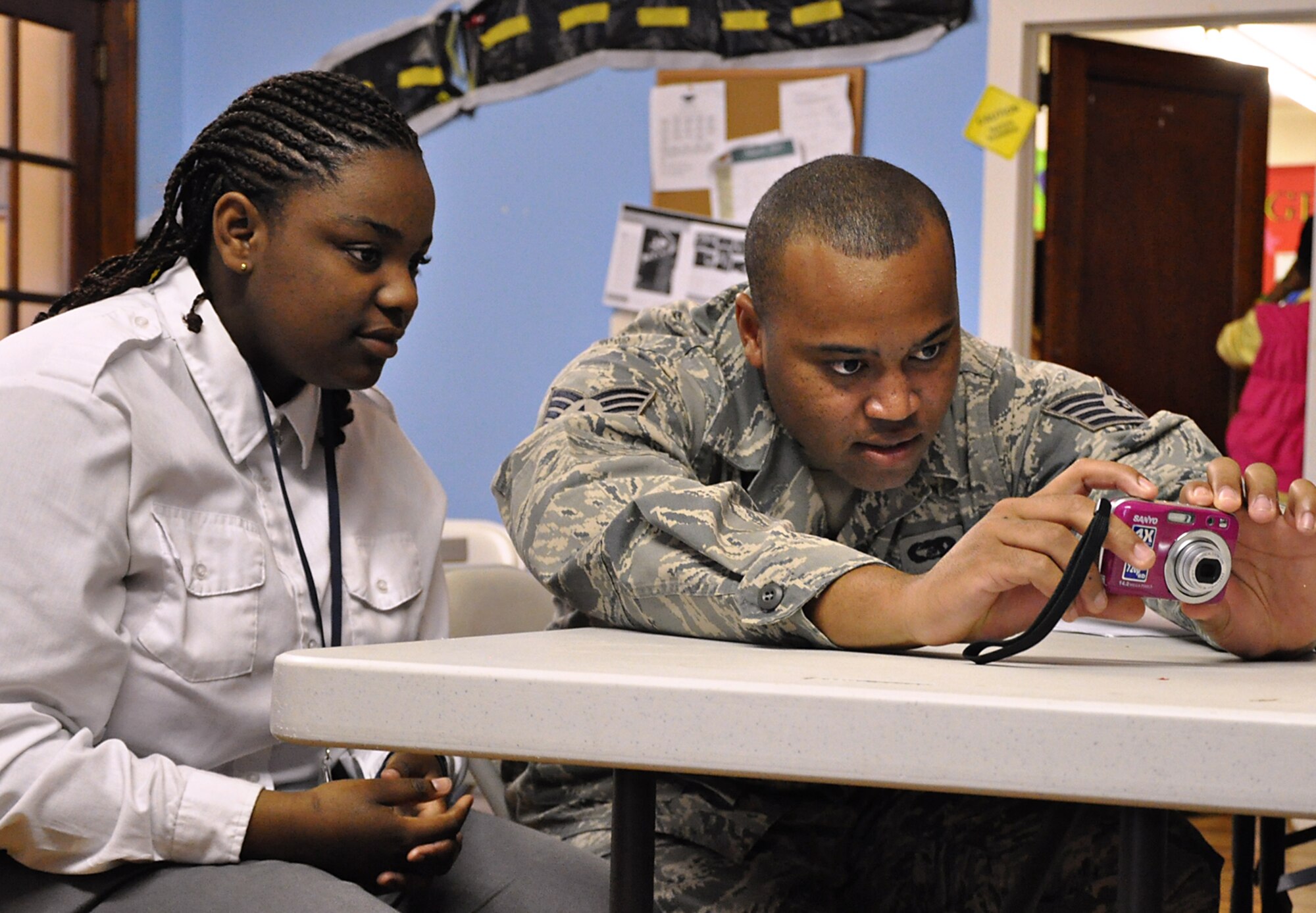 Members from the 315th Airlift Wing Public Affairs office here took time to step from behind the camera and take to the classroom sharing their knowledge and passion for photography with children who participate in an educational partnership between Metanoia and Safe Kids USA at Saint Mathews Church in North Charleston, S.C. March 14. (U.S. Air Force photo by Senior Airman Bobby Pilch)
