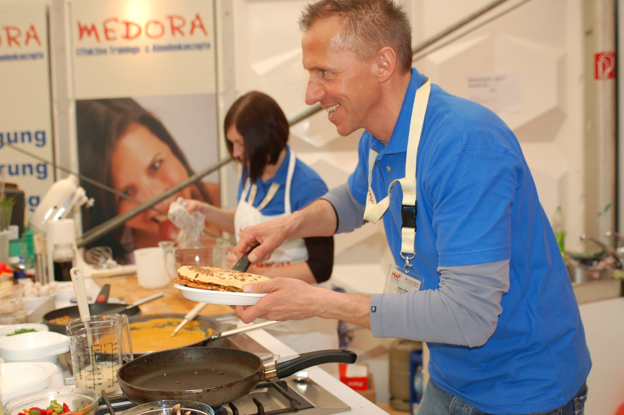BITBURG, Germany -- Cooking teams demonstrate their skills during the 32nd Beda market March 18 in Bitburg, Germany. The Beda market’s theme this year was “Looking, Exploring, Informing” and drew more than 80,000 people from all around the region and the neighboring countries of Luxembourg and Belgium. This event presented both the economical and cultural life of the Eifel-Pruem region in various spots throughout the city. (U.S. Air Force photo/Iris Reiff)