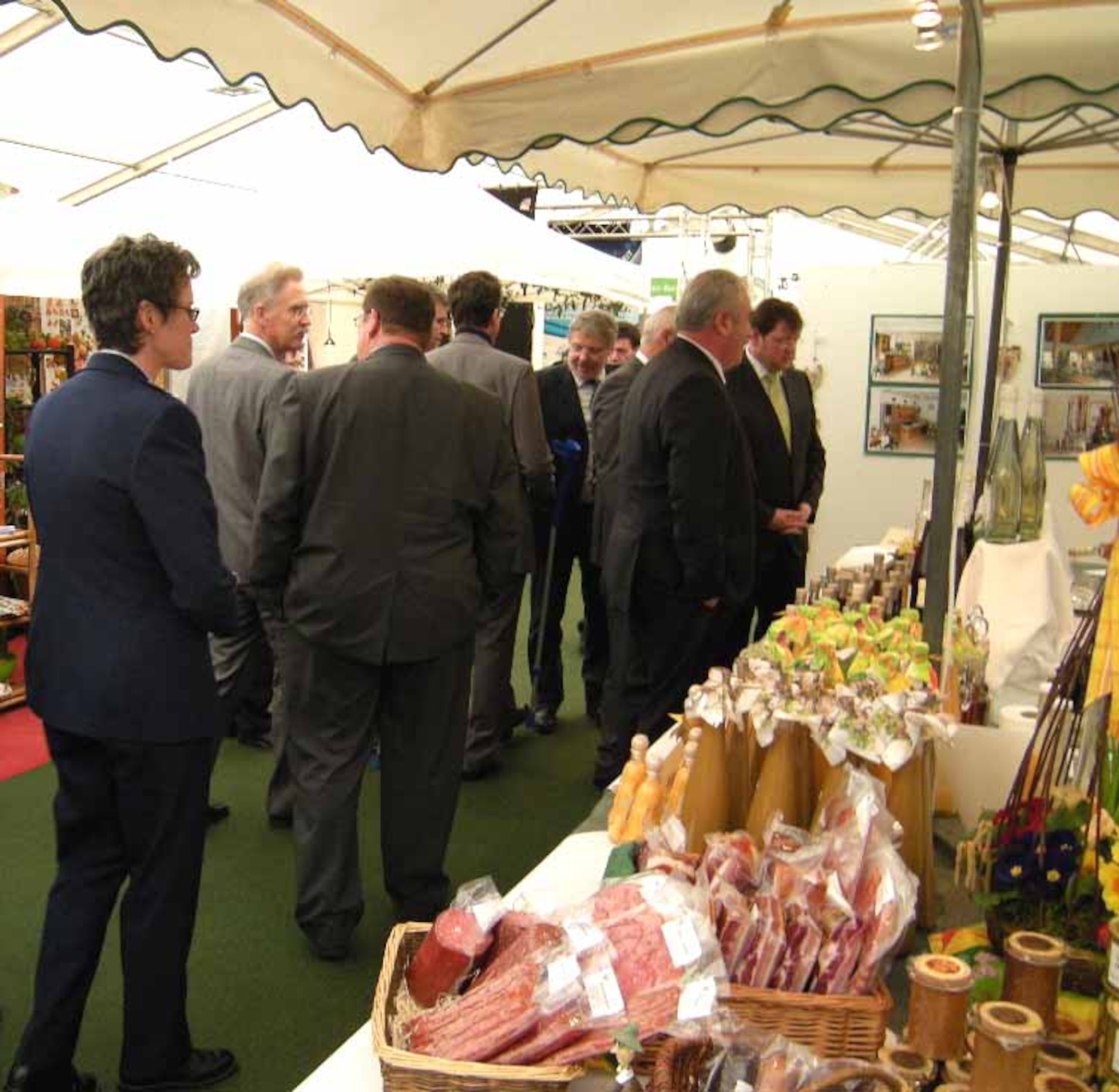 BITBURG, Germany -- Col. Jodine Tooke, 52nd Mission Support Group commander, and local civic leaders walked through a Bitburg Beda market exhibition tent during the 32nd opening ceremony March 18 in Bitburg, Germany. Regional food products and items, characteristic of the Eifel-Pruem region, were on display along with a vast offer in handicraft, art and entertainment. The Beda market’s theme this year was “Looking, Exploring, Informing” and drew more than 80,000 people from all around the region and the neighboring countries of Luxembourg and Belgium. This event presented both the economical and cultural life of the Eifel-Pruem region in various spots throughout the city. (U.S. Air Force photo/Iris Reiff)