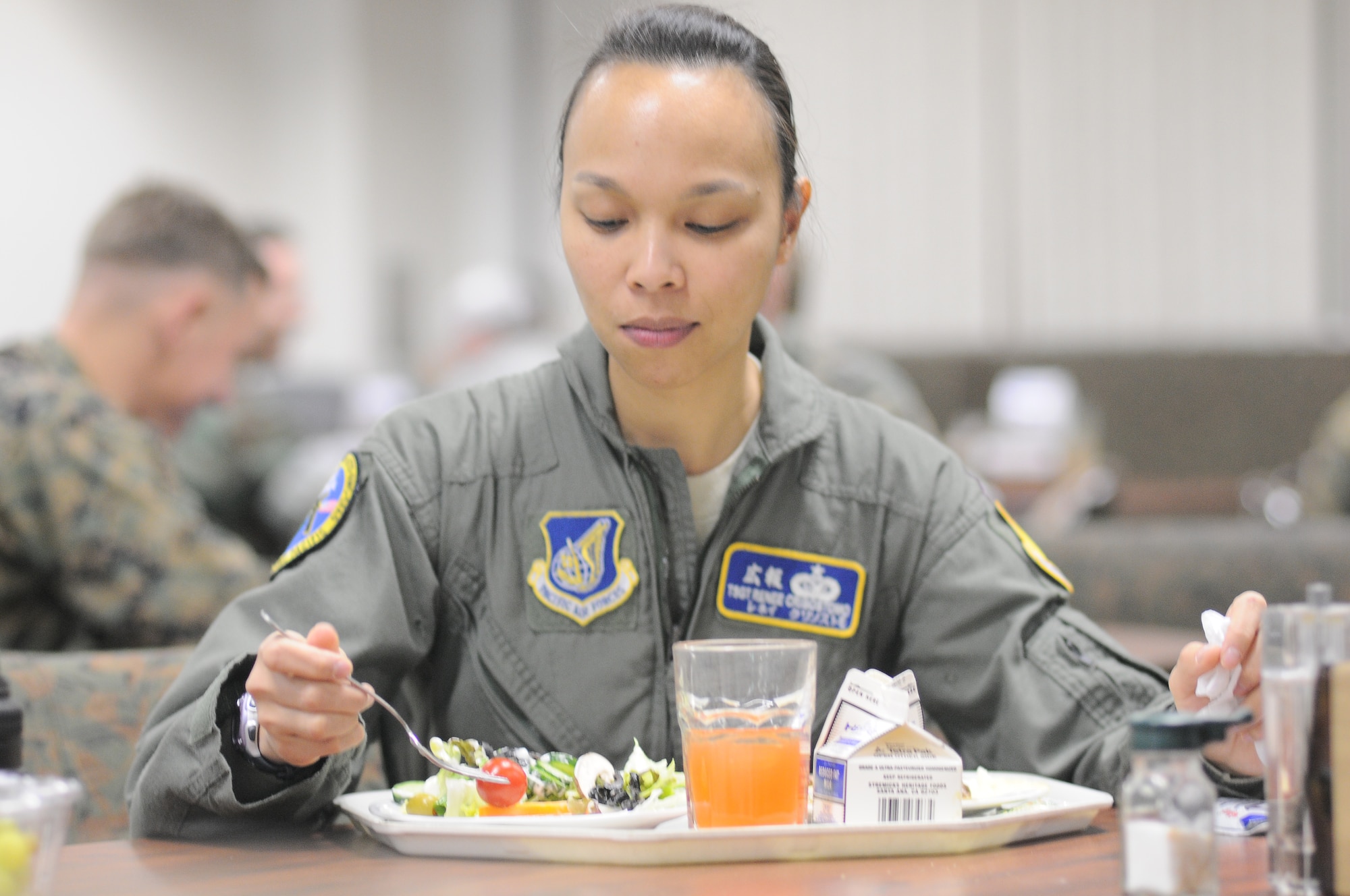 YOKOTA AIR BASE, Japan -- Tech Sgt. Renee Crisostomo, an augmentee helping with Operation Tomodachi relief efforts, enjoys a meal at the Samurai Cafe. March 23, 2011. An influx of military personnel are temporarily assigned to Yokota in support of Operation Tomodachi. The Samurai Cafe has extended meal times for the duration of Operation Tomodachi.  (U.S. Air Force photo/Airman 1st Class Krystal M. Garrett)
