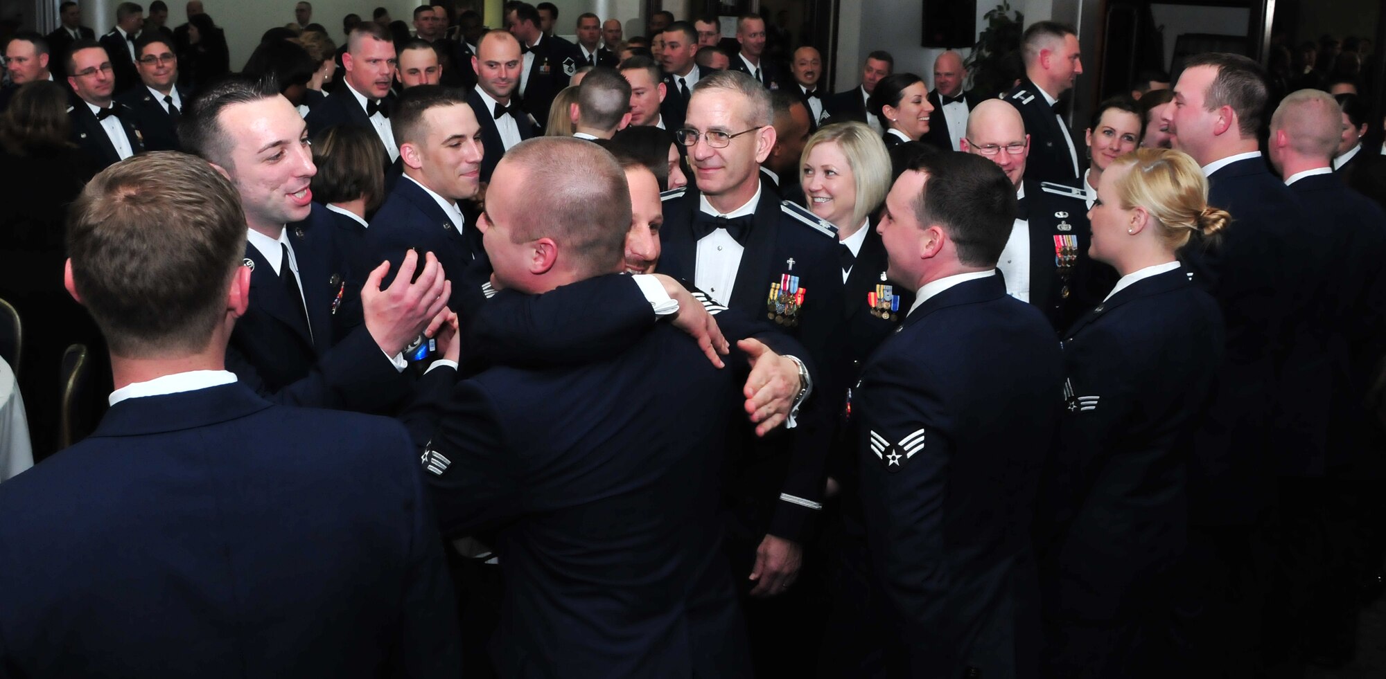 Friends, family and co-workers congratulate Airman Leadership School class 11-4 in the Club Complex March 18, 2011, at Incirlik Air Base, Turkey.  ALS is one of the many professional military education courses in the Air Force. Airman Leadership school prepares and trains future noncommissioned officers for increased responsibilities. The graduates of class 11-4 were Senior Airmen Scott Adams, Nequitta Brown, Andrew Cockerham, Jordan Dottin, Wynn Dressler, Brandon Gannon, Charles Gill, Amos Glenn, Travis Goar, Rebecca Graham, Jacob Marroquin, Jason Rundell, Jarrett Sanford, Jonathan Smith, Michael Watkins, and Joseph White. (U.S. Air Force photo by Staff Sgt. Alexandre Montes/Released)