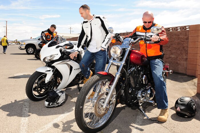 NELLIS AIR FORCE BASE, Nev. --   Master Sgt. Robert Mediavilla and Maj. Gregory Boschert, 99th Logistics Readiness Squadron, prepare for a motorcycle safety course, March 25. The safety course gives motorcycles riders, experienced and new, a refresher in safety and the opportunity to ride  in a large group. (U.S. Air Force photo by Staff Sgt. William P.Coleman)
  

