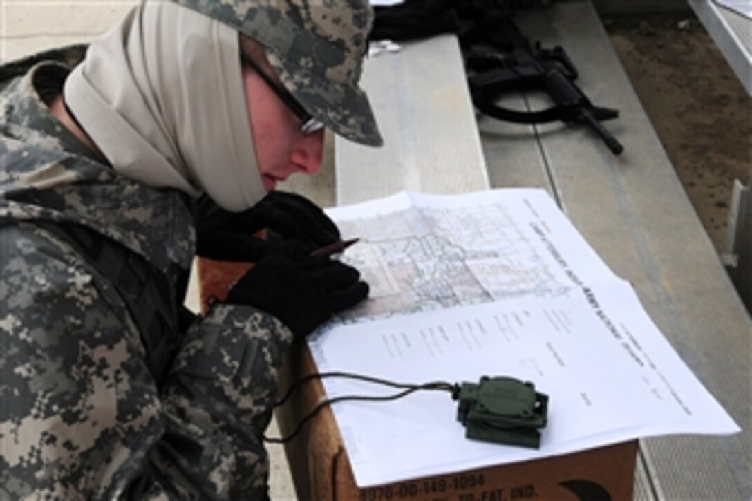 U.S. Army Reserve Spc. Michael Bever plots points from a map during the Best Warrior Competition at Camp Atterbury Joint Maneuver Training Center, March 25, 2011.  The competition, hosted by the 310th Expeditionary Sustainment Command, March 24-27, 2011, included reserve soldiers from Indiana, Illinois, Ohio, Michigan and Wisconsin. The soldiers  went through a series of challenges, to include a road march, written test, appearance board, land navigation.