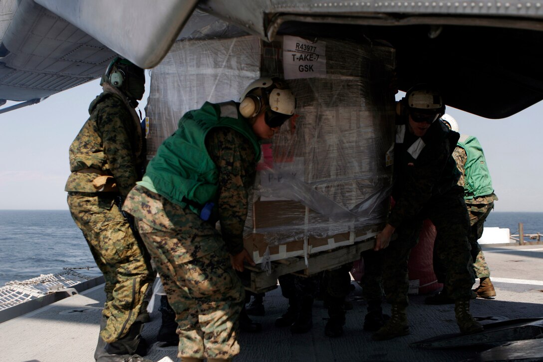 Marines with the 31st Marine Expeditionary Unit, load a pallet of supplies onto a CH-53E Super Stallion helicopter, March 29. The supplies were delivered to Misawa Japan, and used to support humanitarian aid and disaster relief operations currently in progress. The 31st MEU’s involvement is part of a larger U.S. government response, after a 9.0 earthquake and subsequent tsunami struck Japan causing widespread damage. The 31st MEU is ready to support our Japanese partners and to provide assistance when called upon.