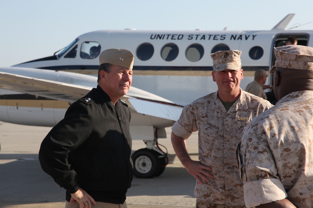 Rear Adm. Alton L. Stocks, left, is greeted upon arrival by the command element of Marine Corps Air Station Cherry Point, Col. Philip J. Zimmerman, center, and Sgt. Maj. Jerry L. Bailey, right, March 29. Stocks, the commander of Navy Medicine East, visited the air station to tour the Naval health clinic.