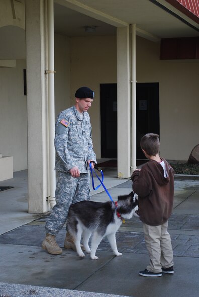 Military family members, their pets, Airmen and other service members process through Travis Air Force Base, Calif., on March 25, 2011, as part of Operation Pacific Passage. Shortly after an 8.9-magnitude earthquake and subsequent tsunami struck Japan on March 11, 2011, Department of Defense officials approved voluntary departures for DOD personnel and family members to return to the United States. U.S. Northern Command was the lead for the departure operation -- naming it "Operation Pacific Passage." According to USNORTHCOM Public Affairs, Travis AFB, Seattle-Tacoma IAP , Wash., and Denver International Airport, Colo., were the main arrival locations. (U.S. Air Force Photo)
