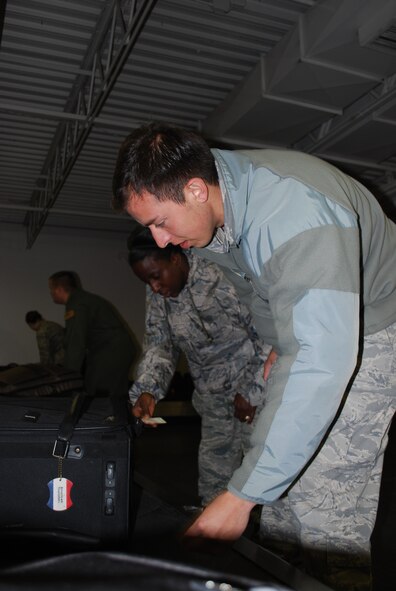 Military family members, their pets, Airmen and other service members process through Travis Air Force Base, Calif., on March 25, 2011, as part of Operation Pacific Passage. Shortly after an 8.9-magnitude earthquake and subsequent tsunami struck Japan on March 11, 2011, Department of Defense officials approved voluntary departures for DOD personnel and family members to return to the United States. U.S. Northern Command was the lead for the departure operation -- naming it "Operation Pacific Passage." According to USNORTHCOM Public Affairs, Travis AFB, Seattle-Tacoma IAP , Wash., and Denver International Airport, Colo., were the main arrival locations. (U.S. Air Force Photo)
