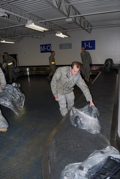 Military family members, their pets, Airmen and other service members process through Travis Air Force Base, Calif., on March 25, 2011, as part of Operation Pacific Passage. Shortly after an 8.9-magnitude earthquake and subsequent tsunami struck Japan on March 11, 2011, Department of Defense officials approved voluntary departures for DOD personnel and family members to return to the United States. U.S. Northern Command was the lead for the departure operation -- naming it "Operation Pacific Passage." According to USNORTHCOM Public Affairs, Travis AFB, Seattle-Tacoma IAP , Wash., and Denver International Airport, Colo., were the main arrival locations. (U.S. Air Force Photo)
