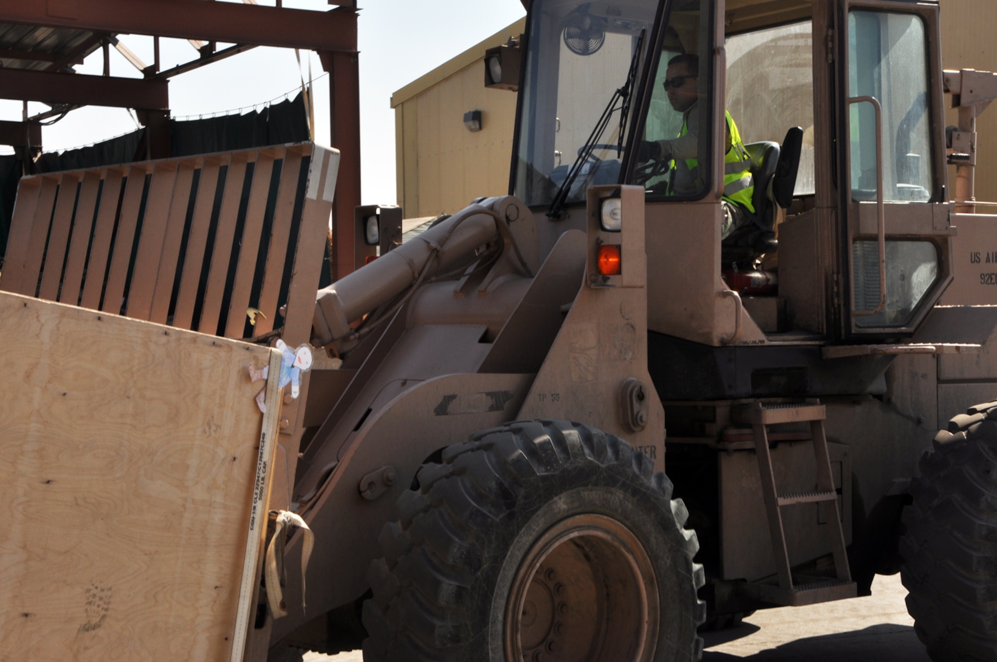 Flat Stanley takes a ride with some cargo moved by a 376th Expeditionary Logistics Readiness Squadron forklift at the Transit Center at Manas, Kyrgyzstan. Upon arriving at the Transit Center, Flat Stanley has been spotted participating in a number of Transit Center activities. Stanley is now safely back in his envelope and in the mail on his way home to North Carolina. (U.S. Air Force photo/Master Sgt. Daniel Nathaniel)