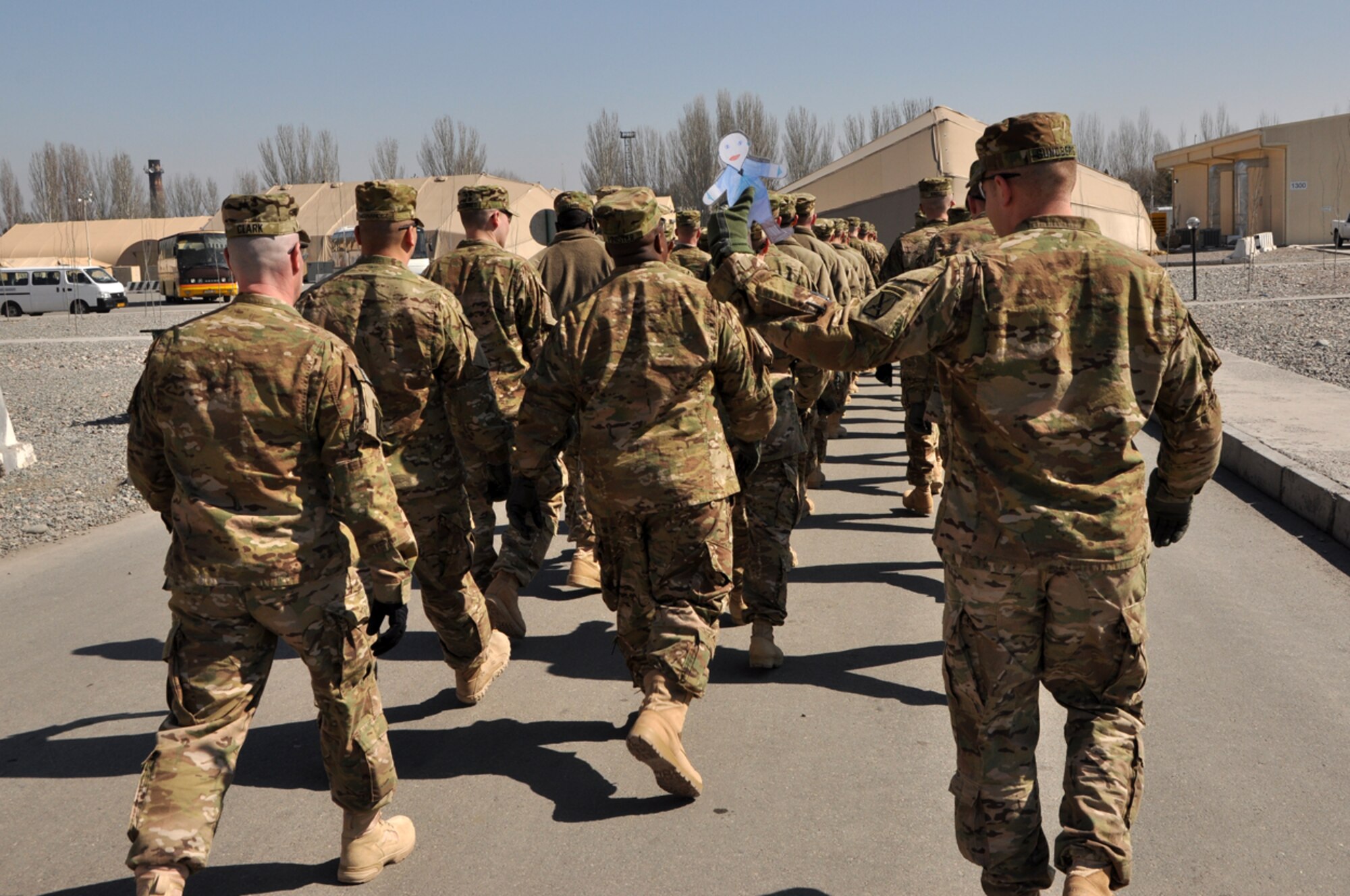 Flat Stanley marches with the 10th Mountain Division, Ft. Drum, N.Y., as they pass through the Transit Center at Manas, Kyrgyzstan. Upon arriving at the Transit Center, Flat Stanley has been spotted participating in a number of Transit Center activities. Stanley is now safely back in his envelope and in the mail on his way home to North Carolina. (U.S. Air Force photo/Master Sgt. Daniel Nathaniel)