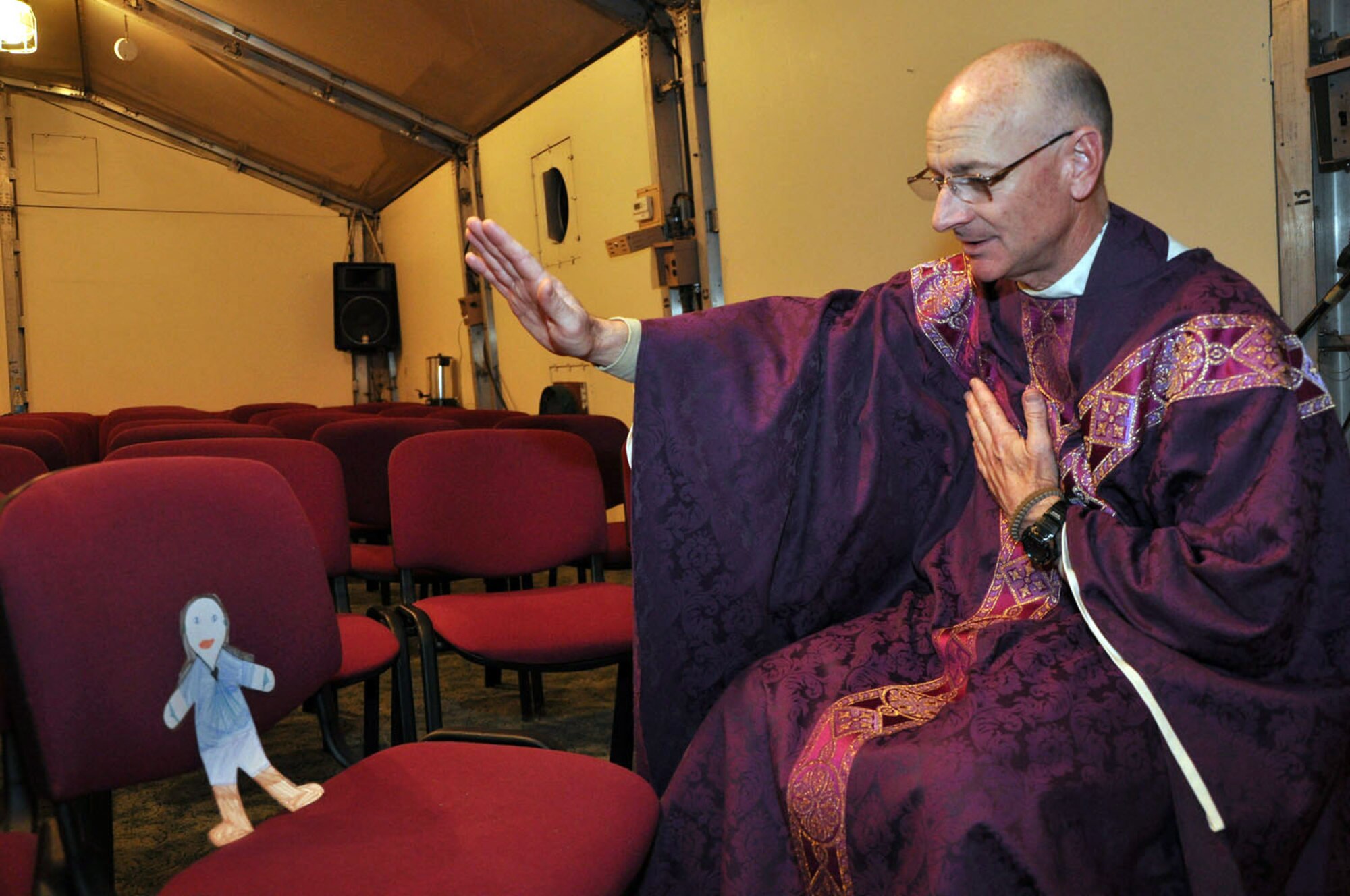 Flat Stanley receives spiritual guidance from Chaplain (Lt. Col.) Daniel Bergbower, Transit Center at Manas, Kyrgyzstan. Upon arriving at the Transit Center, Flat Stanley has been spotted participating in a number of Transit Center activities. Stanley is now safely back in his envelope and in the mail on his way home to North Carolina. (U.S. Air Force photo/Master Sgt. Daniel Nathaniel)