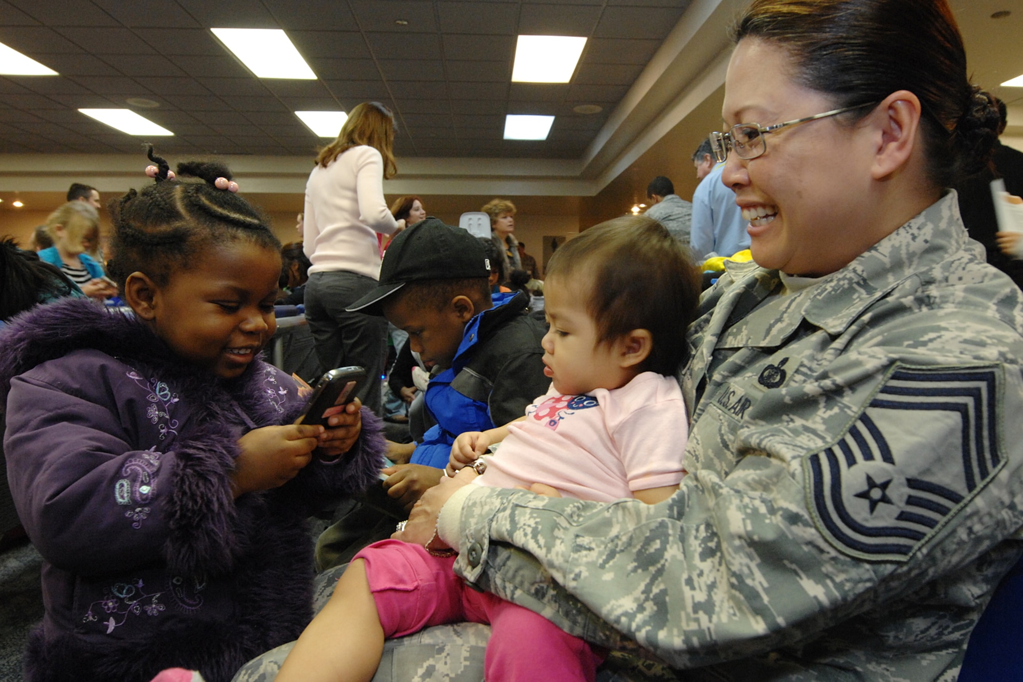 Military family members, Airmen and others process through Travis Air Force Base, Calif., on March 22, 2011, as part of Operation Pacific Passage. Shortly after an 8.9-magnitude earthquake and subsequent tsunami struck Japan on March 11, 2011, Department of Defense officials approved voluntary departures for DOD personnel and family members to return to the United States. U.S. Northern Command was the lead for the departure operation -- naming it "Operation Pacific Passage." According to USNORTHCOM Public Affairs, Travis AFB, Seattle-Tacoma IAP , Wash., and Denver International Airport, Colo., were the main arrival locations. (U.S. Air Force Photo)
