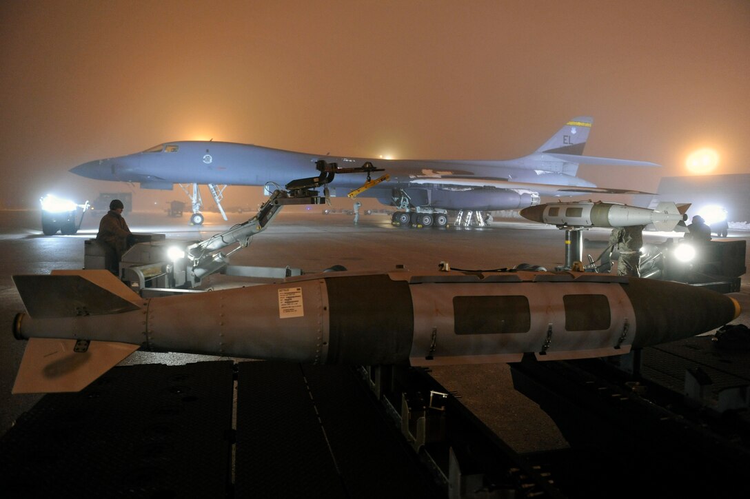 Airmen of the 28th Aircraft Maintenance Squadron prepare a B-1B Lancer to support Operation Odyssey Dawn on Ellsworth Air Force Base, S.D., March 27, 2011.   Their work was made especially difficult by severe weather conditions including snow, ice, and freezing fog. (U.S. Air Force photo/Staff Sgt. Marc I. Lane)
