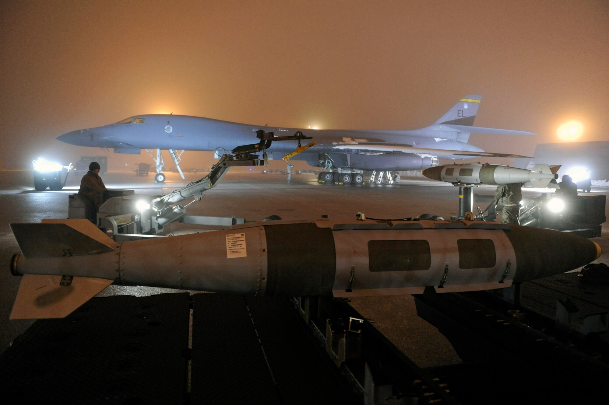 Airmen of the 28th Aircraft Maintenance Squadron prepare a B-1B Lancer to support Operation Odyssey Dawn on Ellsworth Air Force Base, S.D., March 27, 2011.   Their work was made especially difficult by severe weather conditions including snow, ice, and freezing fog. (U.S. Air Force photo/Staff Sgt. Marc I. Lane)