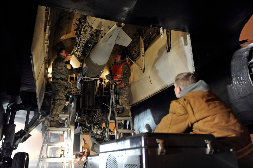 Airmen of the 28th Aircraft Maintenance Squadron, load a two thousand pound bomb into a B-1B Lancer aircraft bomb bay on Ellsworth Air Force Base, S.D., March 27, 2011.  With less than two days from first notice to takeoff, Ellsworth Airmen generated hundreds of weapons for several aircraft to support Operation Odyssey Dawn. (U.S. Air Force photo/Staff Sgt. Marc I. Lane)