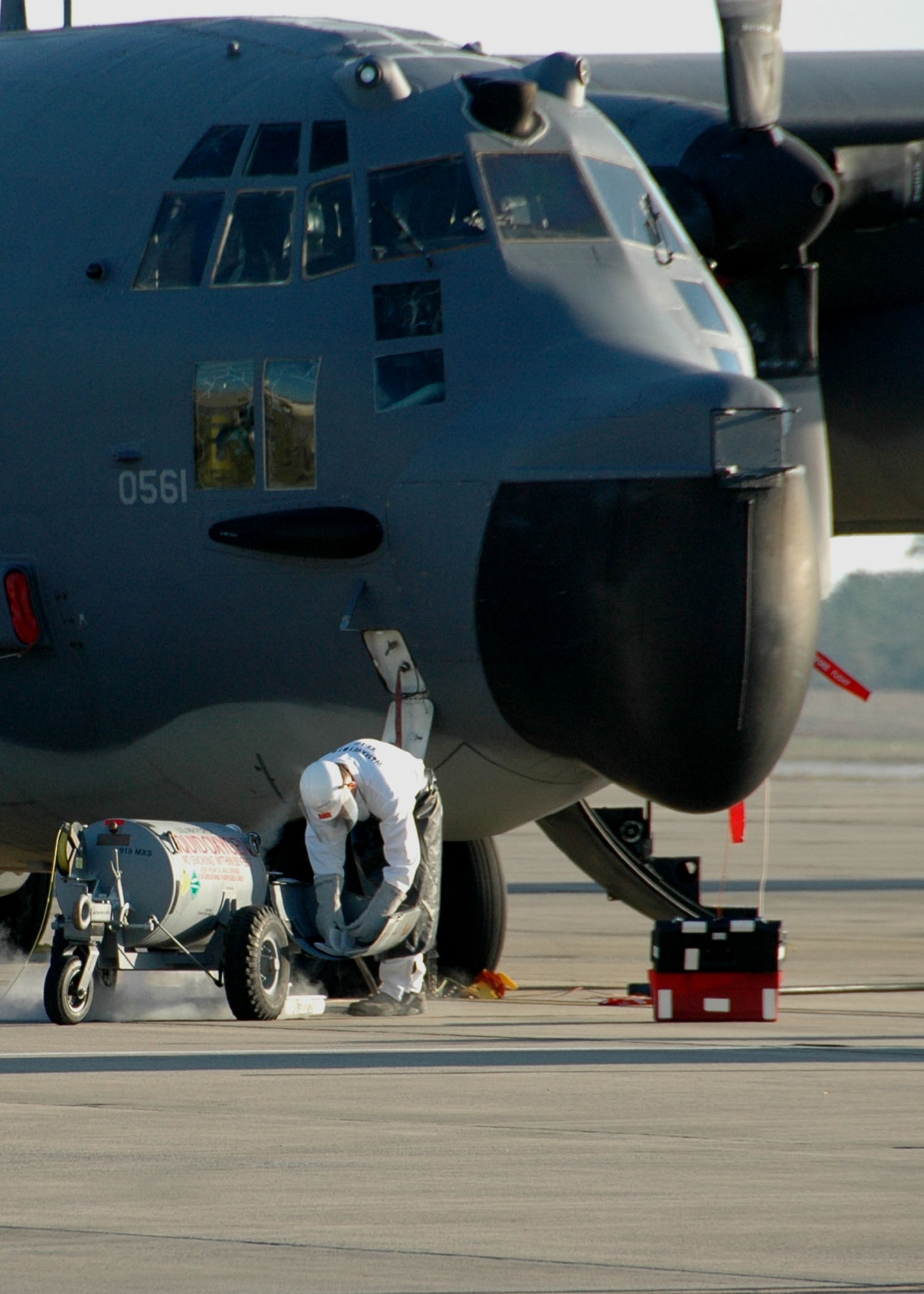 Senior Airman James Lints, a 919th Aircraft Maintenance Squadron crew chief, connects a liquid oxygen tank to a 919th Special Operations Wing MC-130E Combat Talon I on the Duke Field flightline March 24.   The liquid oxygen is used in the aircraft's life support systems.  (U.S. Air Force photo/Dan Neely)