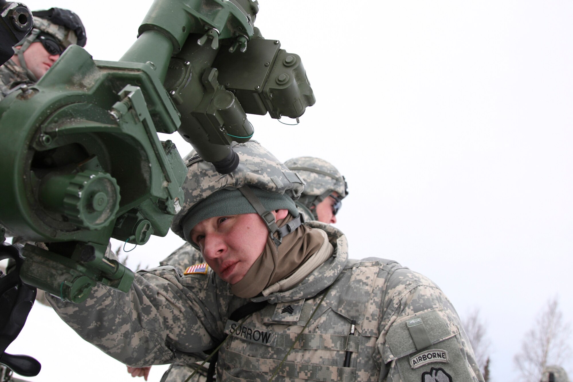 Crew gunner Sgt. Christopher Sorrow sets the elevation on M119A2 Howitzer.  The M119A2 fires all standard NATO 105mm artillery ammunition, including the M1 High Explosive, M314 Illuminating, M60/M60A2 White Phosphorous (smoke).  In addition, it fires the M913 and M760 extended range ammunitions. 
