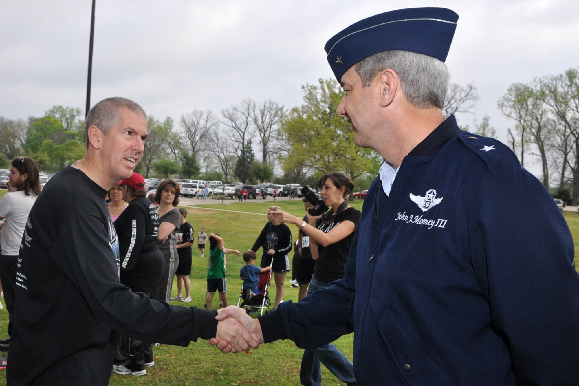 Patrick Keen, hospital attorney, Overton Brooks VA Medical Center, greets Brig. Gen. John J. Mooney III, commander, 307th Bomb Wing, Barksdale Air Force Base, La., at the Overton Brooks VA Medical Center’s 2nd Annual Warrior Run at Veterans Park in Shreveport, La., March 26, 2011. General Mooney was on hand at the annual event to start the race. The proceeds raised at the event will support OBVAMC Voluntary Service programs such as: homeless Veteran services, rehabilitation equipment, social service assistance, comfort items, transportation, holiday gifts and other volunteer funded services. (U.S. Air Force photo/Tech. Sgt. Jeff Walston)
 
