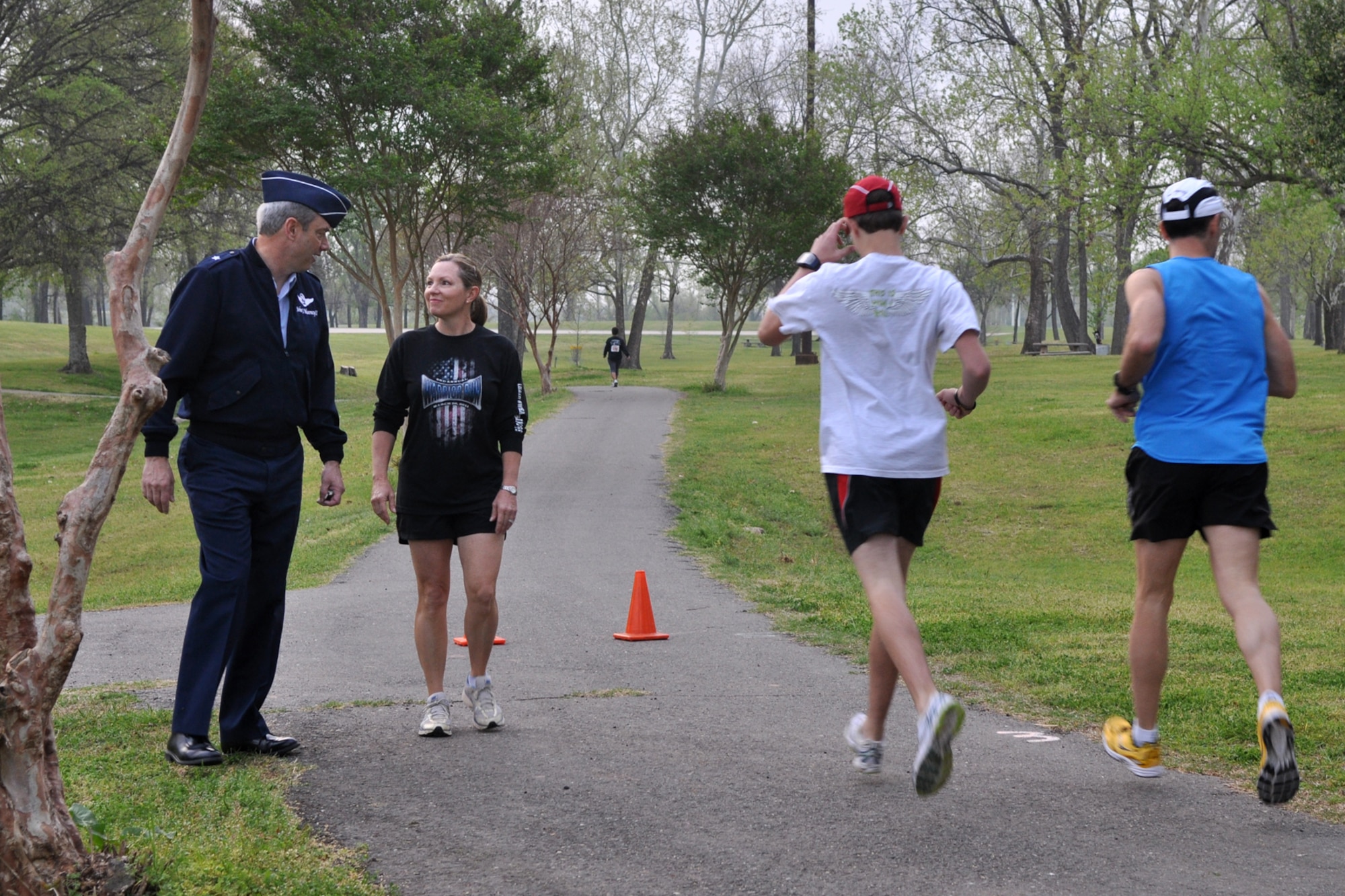 Brig. Gen. John J. Mooney III, commander, 307th Bomb Wing, Barksdale Air Force Base, La., and Susan Geer, primary care nurse, Overton Brooks VA Medical Center, discuss the start of the 2nd Annual Warrior Run at Veterans Park in Shreveport, La., March 26, 2011. General Mooney was on hand at the annual event to start the race. The proceeds raised at the event will support OBVAMC Voluntary Service programs such as: homeless Veteran services, rehabilitation equipment, social service assistance, comfort items, transportation, holiday gifts and other volunteer funded services. (U.S. Air Force photo/Tech. Sgt. Jeff Walston)