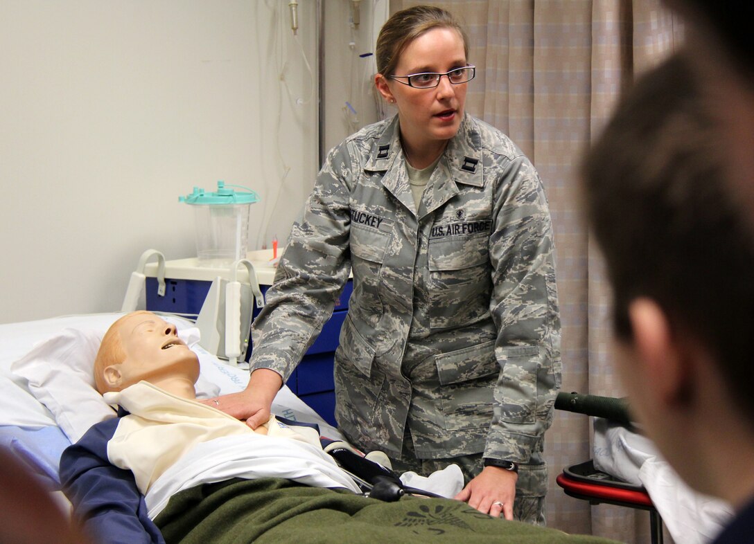 Capt. Emily Stuckey,  932nd Medical Squadron, shows a simulated patient to Air Force JROTC cadets from St. Clair, Mo.  Captain Stuckey also talked about training opportunities and medical career fields in the Air Force Reserve.  The cadets also toured the C-40 and C-9C aircraft and saw a robot demonstration from the unit's Explosive Ordnance Disposal (EOD) flight.  The 932nd Airlift Wing is based at Scott Air Force Base, Il (U.S. Air Force photo/Tech. Sgt. Dan Oliver)   