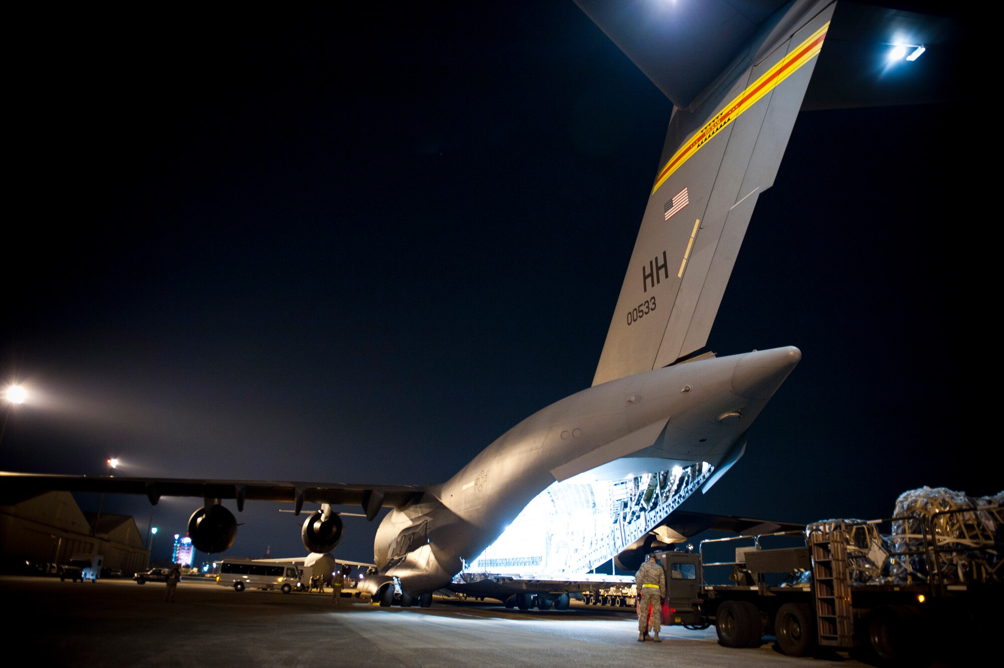 YOKOTA AIR BASE, Japan -- A C-17 Globemaster III sits on the flight line after arriving from Guam with supplies here March 29. The 374th Contracting Squadron has worked around the clock with the U.S. Government to have these supplies purchased in support of Operation Tomodachi. (U.S. Air Force photo/Staff Sgt. Chad C. Strohmeyer)