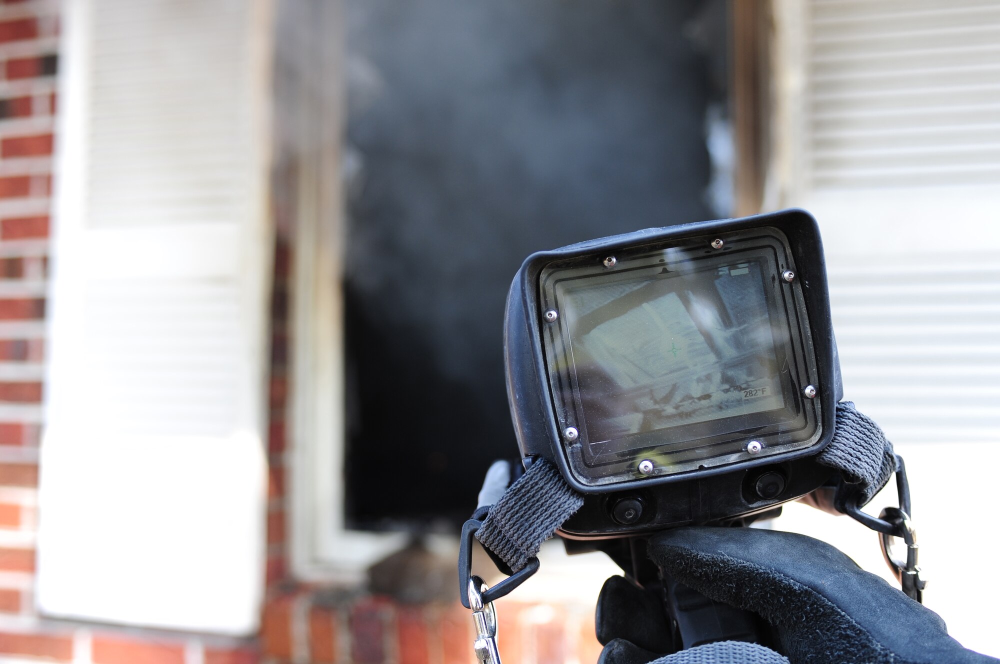 SEYMOUR JOHNSON AIR FORCE BASE, N.C. -- The fire department checks for hot spots using a Scott brand thermal imaging camera to ensure fires are not restarted by hot coals. (U.S. Air Force photo/Senior Airman Rae Perry) (RELEASED)