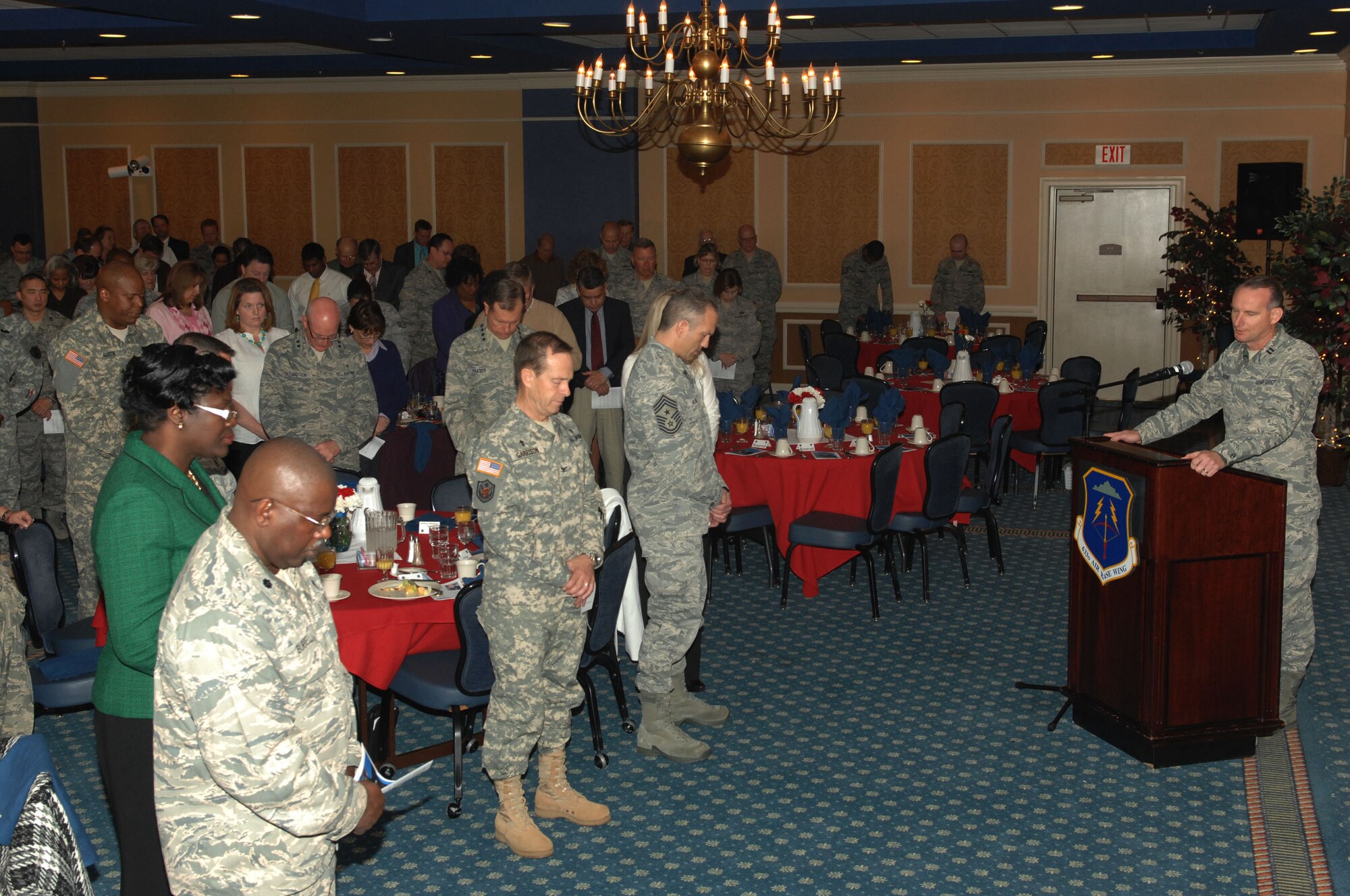 Capt. David Barnes, 633d Air Base Wing chaplain, closes the 58th annual National Prayer Breakfast in prayer at Langley’s Enlisted Club, March 29, 2011.  The first Presidential Prayer Breakfast was established in 1953 by the Senate, House of Prayer Groups and President Eisenhower. (U.S. Air Force photo by Airman 1st Class Racheal Watson/Released)