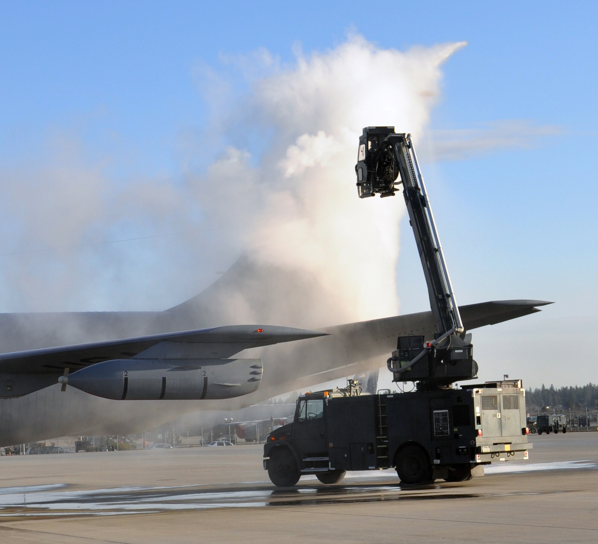 Maintenance crews from the 92nd and 141st Air Refueling Wings of Fairchild Air Force Base, Wash., de-ice a KC-135 Stratotanker prior to its take off from Spokane International Airport, Wash., to support Operation Odyssey Dawn on March 23, 2011. Tankers from Fairchild  support the Air Force, Navy and NATO fighter aircraft throughout the operation. (U.S. Air Force Photo/Master Sgt. Ronald Van Ausdal)