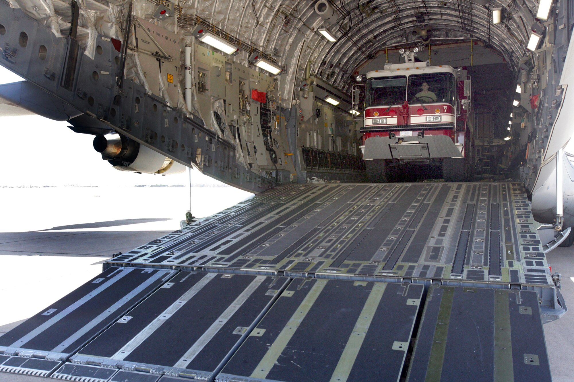 Airmen from Altus Air Force Base, Okla., offload a firefighting crash truck March 11, 2011, at Fort Sill. (Photo/James Brabenec)