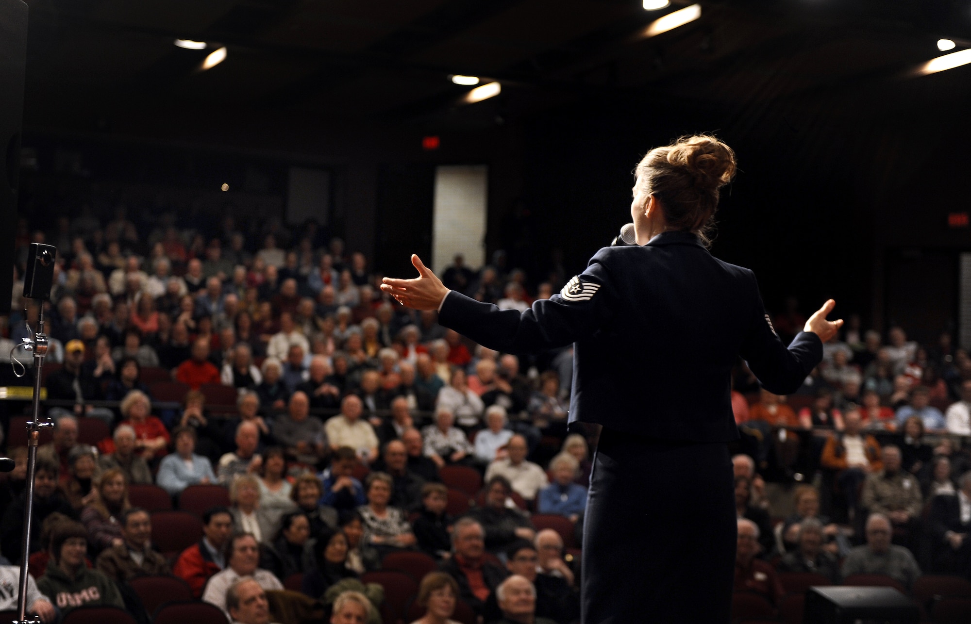 Ames, IA - Tech. Sgt. Krista Joyce, the vocalist with the Heartland of America Band's Noteables jazz ensemble, performs at Ames High School's auditorium in Ames, Iowa, March 27. Jazz fans filled into a 600-seat auditorium to see the Air Force ensemble perform. U.S. Air Force photo by Josh Plueger (released)
