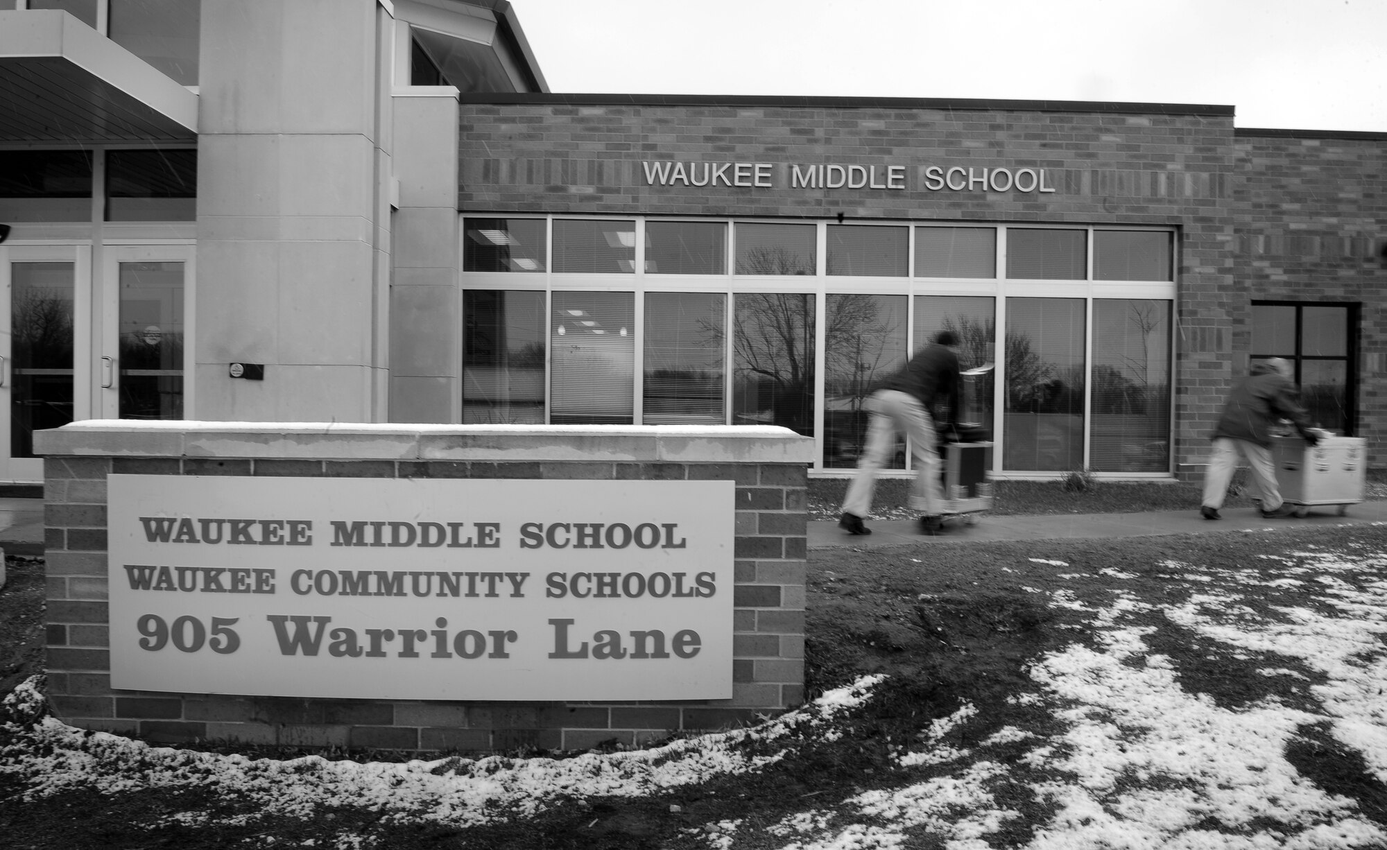 OFFUTT AIR FORCE BASE, Neb. - Airmen with the Heartland of America Band's Noteables jazz ensemble, roll their equipment into Waukee Middle School's band room in Waukee, Iowa, for a two-part concert for 200 students. The band unloaded their equipment with streamlined accuracy from the equipment truck with a final set up taking roughly 20 minutes before they perform their first sound check. U.S. Air Force photo by Josh Plueger (released)
