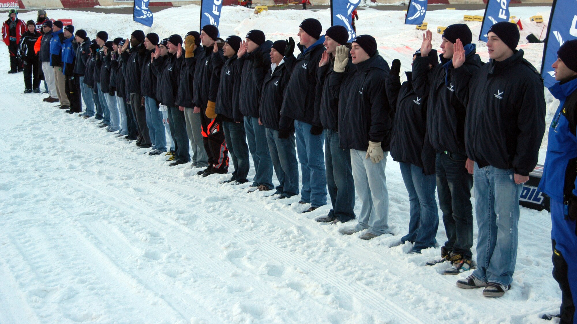 Twenty-eight Delayed Enlistment Program  members recited the Oath of Enlistment, led by Lt. Col. Derek Dill, 343rd Recruiting Squadron commander, at the AMSOIL Championship Snocross Series at the Elkco Speedway March 12. The three-day effort also generated interest from nearly 200 potential applicants. (U.S. Air Force photo/Tech. Sgt. David J. McCarrison)