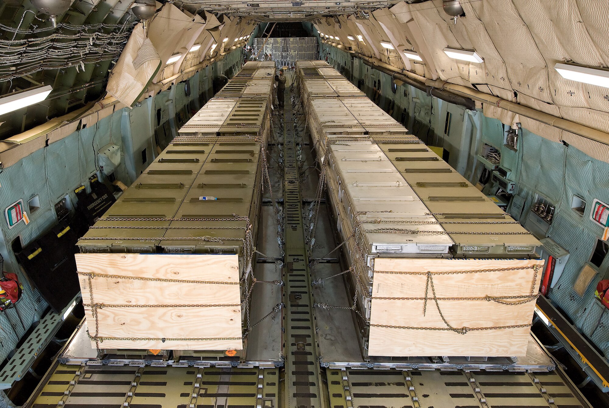 Airmen load cargo onto a C-5M Super Galaxy aircraft March 25 on Dover Air Force Base, Del. The cargo is bound for Italy in support of Joint Task Force Odyssey Dawn, which is the U.S. Africa Command task force established to provide operational and tactical command and control of U.S. military forces supporting the international response to the unrest in Libya and enforcement of United Nations Security Council Resolution 1973. UNSCR 1973 authorizes all necessary measures to protect civilians in Libya under threat of attack by Qadhafi regime forces. (U.S. Air Force photo by Jason Minto/Released)