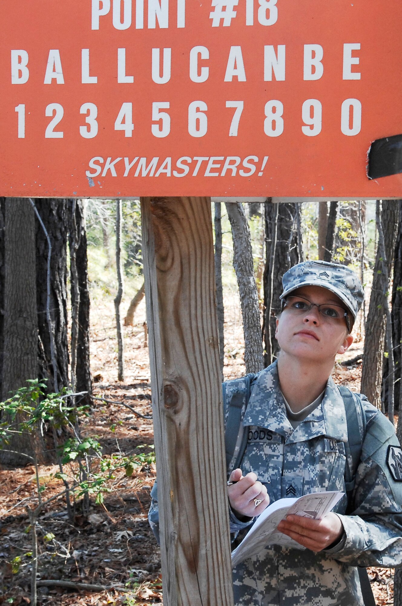 Army Sgt. Sarah Woods, drill sergeant candidate with Charlie Company, 2nd Battalion, 417th Regiment, plots a coordinate point during the land navigation portion of the Best Warrior competition at Fort Eustis, Va., March 25, 2011. Soldiers from various bases displayed their mental and physical capabilities to win Best Warrior in their division. (U.S. Air Force photo by Airman 1st Class Kayla Newman/Released)
