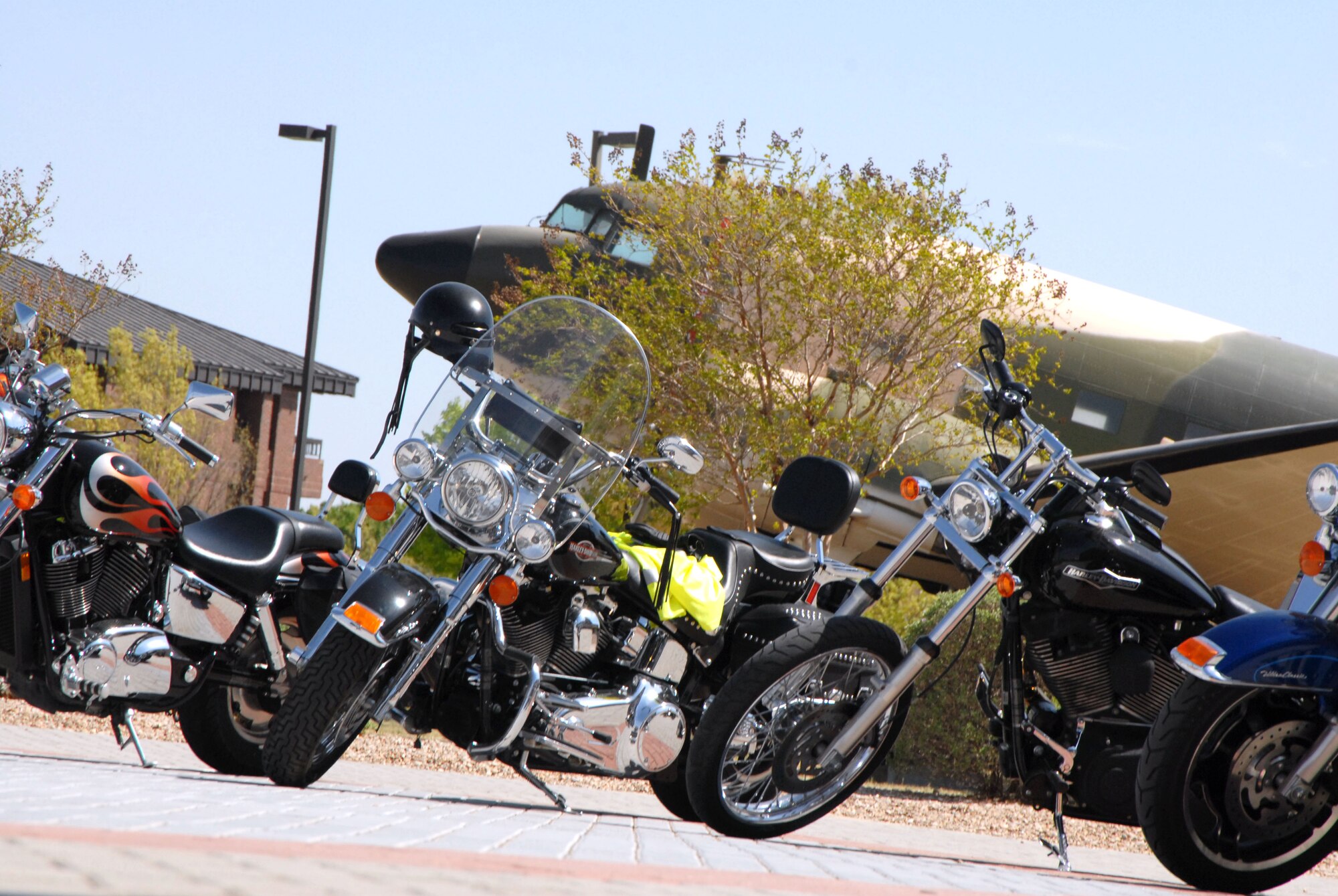 GOODFELLOW AIR FORCE BASE, Texas-- More than 20 members of the Green Knights Motorcycle Safety Club parade around base with a police escort, March 25. The event, which is held to raise motorcycle safety awareness, takes place as part of a base-wide effort to prevent motorcycle mishaps. (U.S. Air Force photo/Airman 1st Class Jessica Keith)