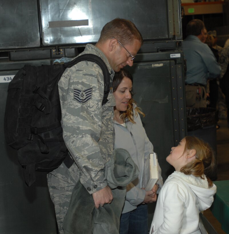 GRISSOM AIR RESERVE BASE, Ind., --  Tech. Sgt. Robert Delee, 434th Security Forces Squadron, is greeted by family members upon his return to Grissom after a six-month deployment (U.S. Air Force photo)