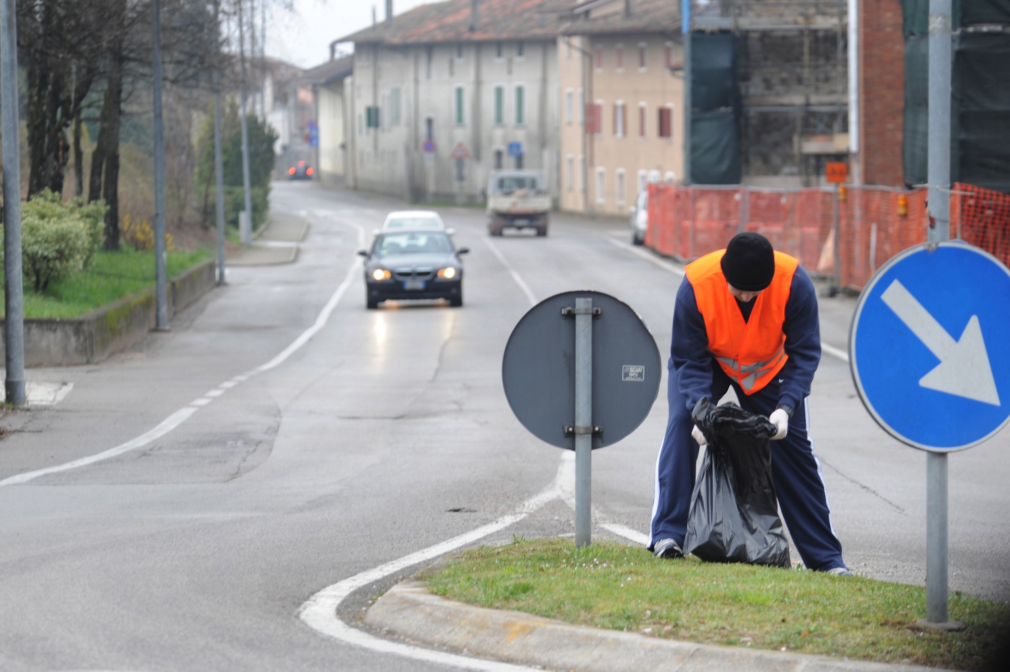 Staff Sgt. Wesley Jackson, 8th Air Support Operations Squadron vehicle maintainer, collects trash along the side of the road as part of the 8th ASOS community beautification project, March 27. Eighteen volunteers cleaned roads from Area F to Area 1, and those leading from Area F to the mountain highway, collecting 25 bags of refuse.  (U.S. Air Force photo/ Staff Sgt. Nadine Y. Barclay)