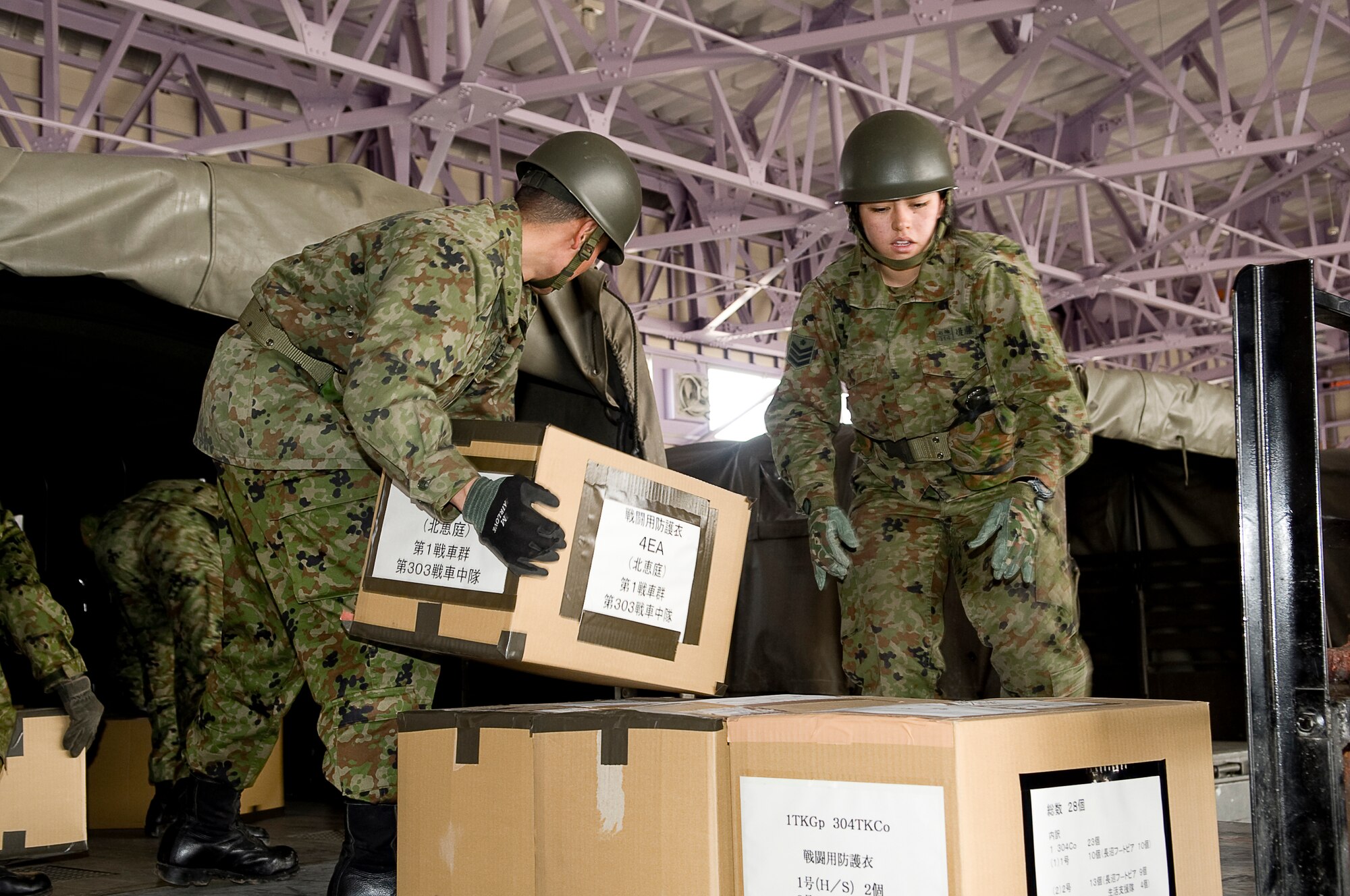 HANAMAKI AIRPORT, Japan -- Members of the Japanese Defense Force load a truck with boxes delivered from a 36th Airlift Squadron C-130 at Hanamaki Airport, March 29. The C-130 will deliver humanitarian goods and supplies to the Japanese Defense Force in support of Operation Tomodachi. (U.S. Air Force photo by/Master Sgt. Jeromy K. Cross)





